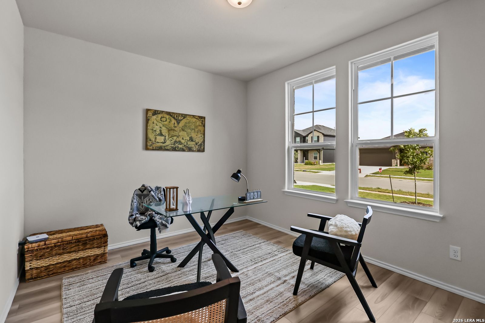 Bright home office with glass-top desk in The Douglas C floor plan by Davidson Homes at Hannah Heights, Seguin, Texas.