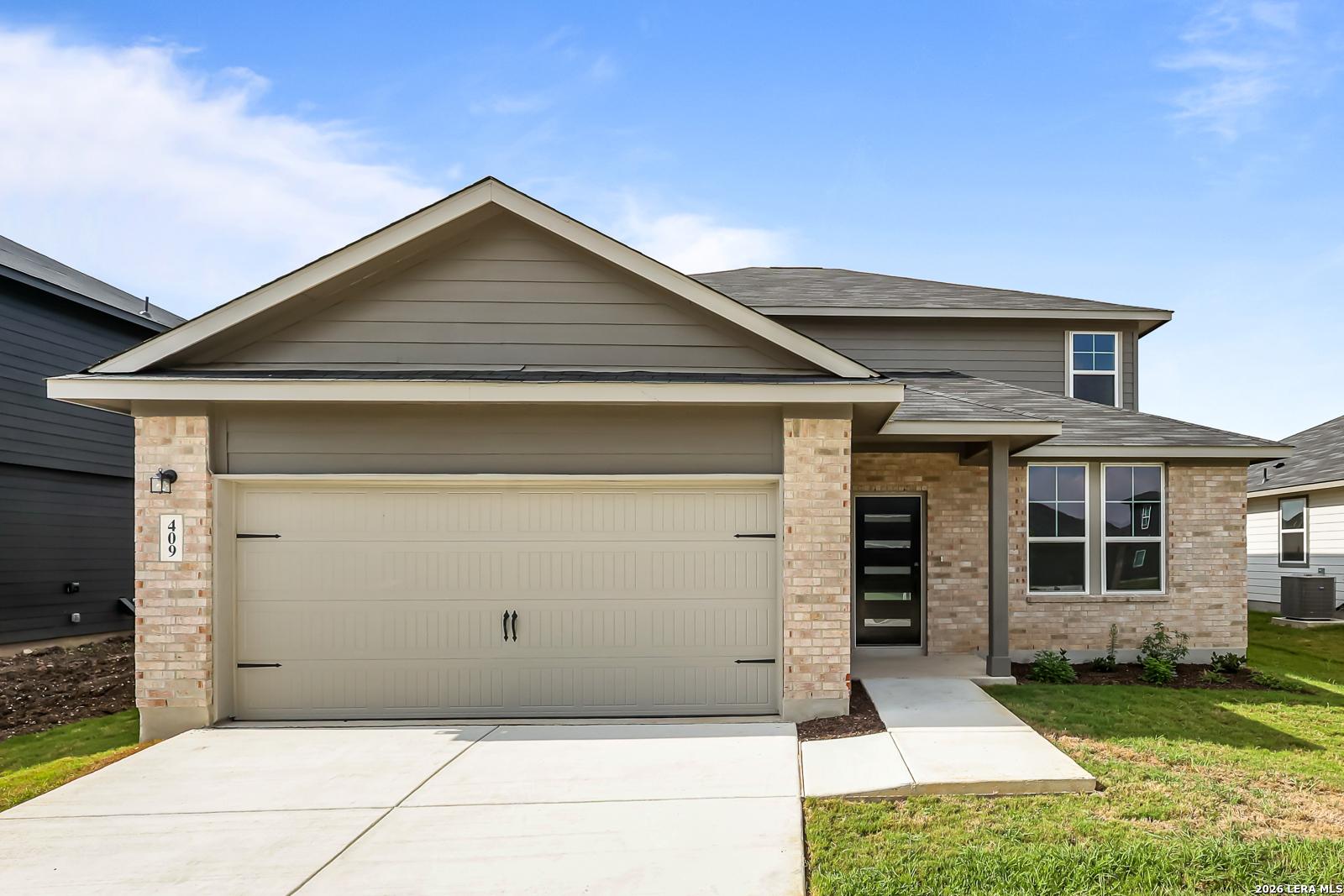 Two-story Douglas C floor plan by Davidson Homes with a two-car garage in Hannah Heights, Seguin, Texas.