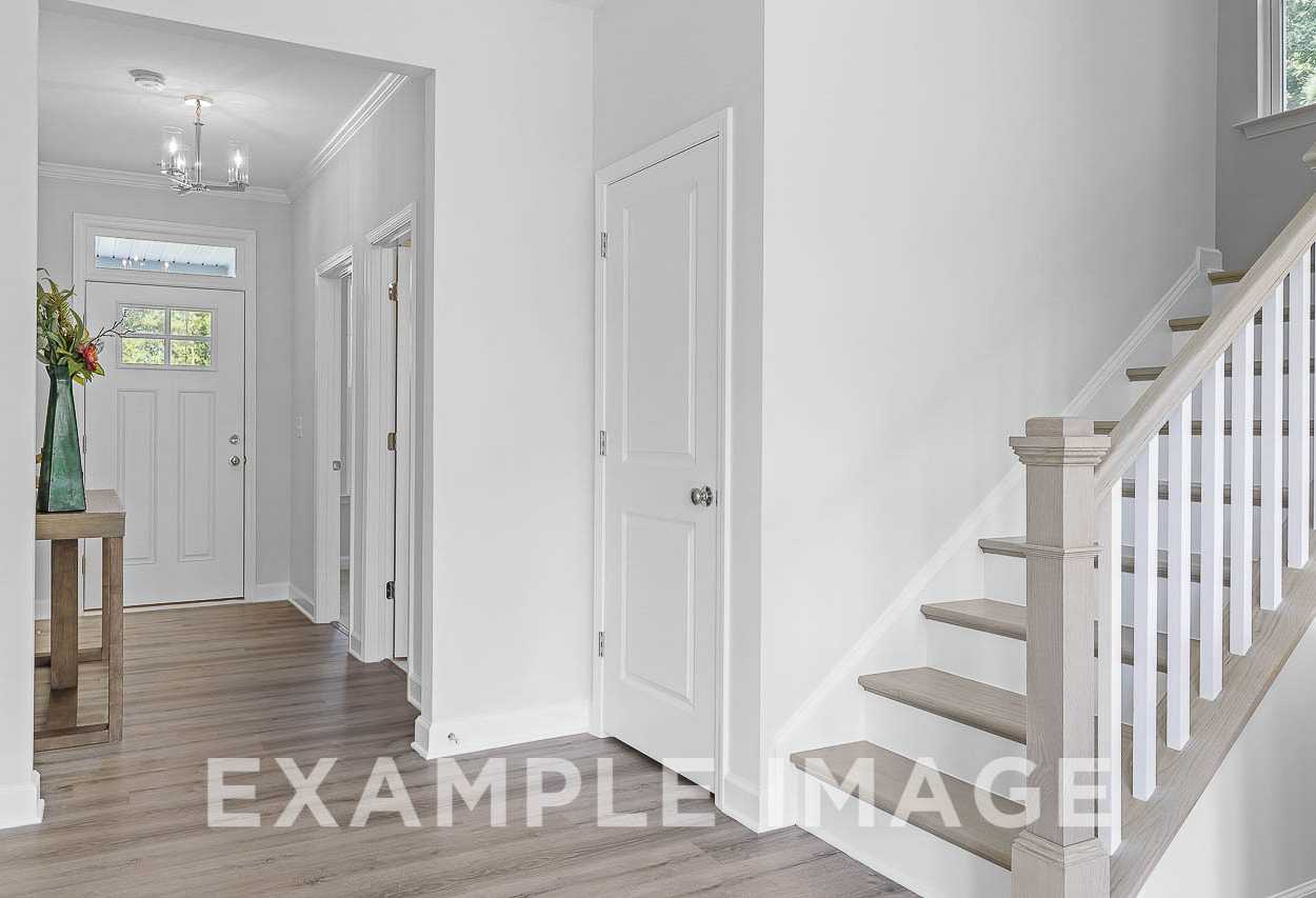 Davidson Homes the Chestnut Plan entryway with stairs to second floor and hallway closet
