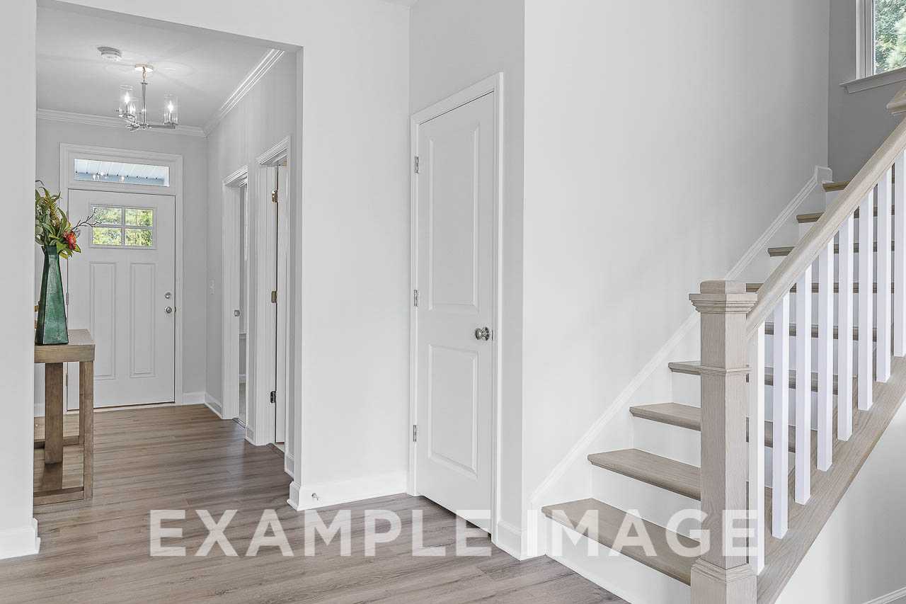 Davidson Homes the Chestnut Plan entryway with stairs to second floor and hallway closet