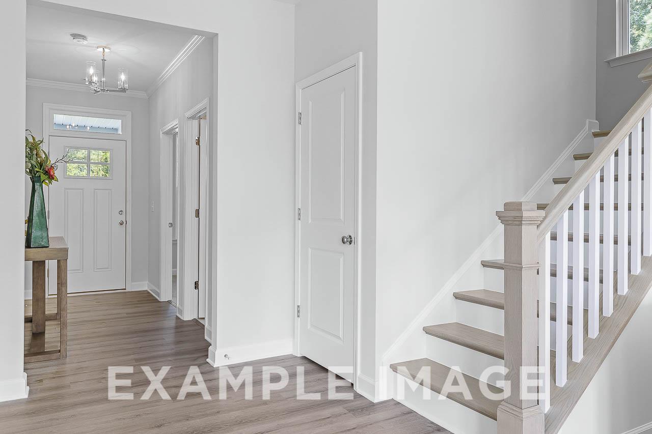 Davidson Homes the Chestnut Plan entryway with stairs to second floor and hallway closet