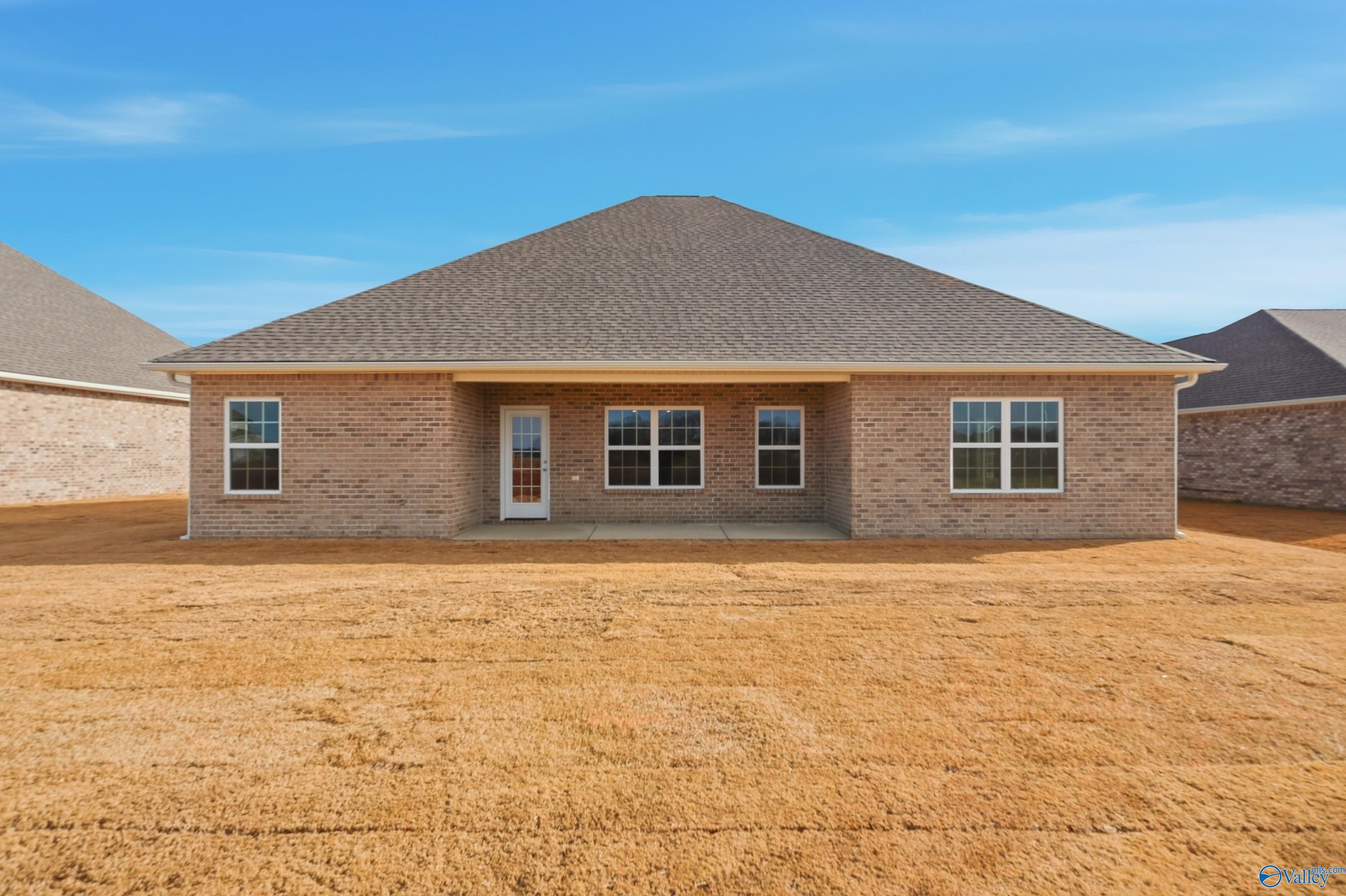 Brick exterior of The Lanier 4-bedroom single-story home by Davidson Homes in Pikes Ridge, Meridianville, Alabama