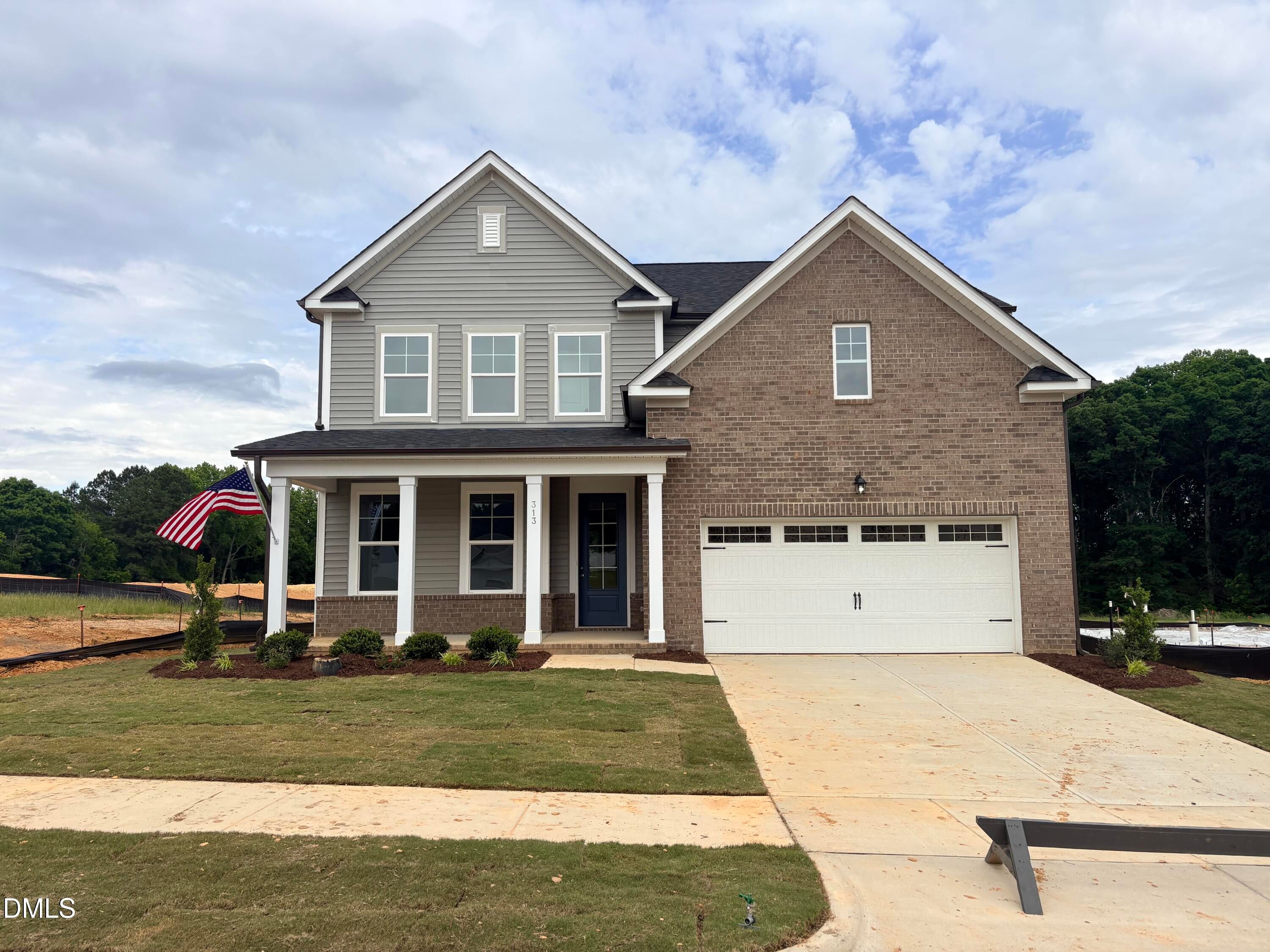 Two-story Hickory II C floor plan by Davidson Homes featuring brick and siding exterior in Woodland Crossing, Zebulon, NC.