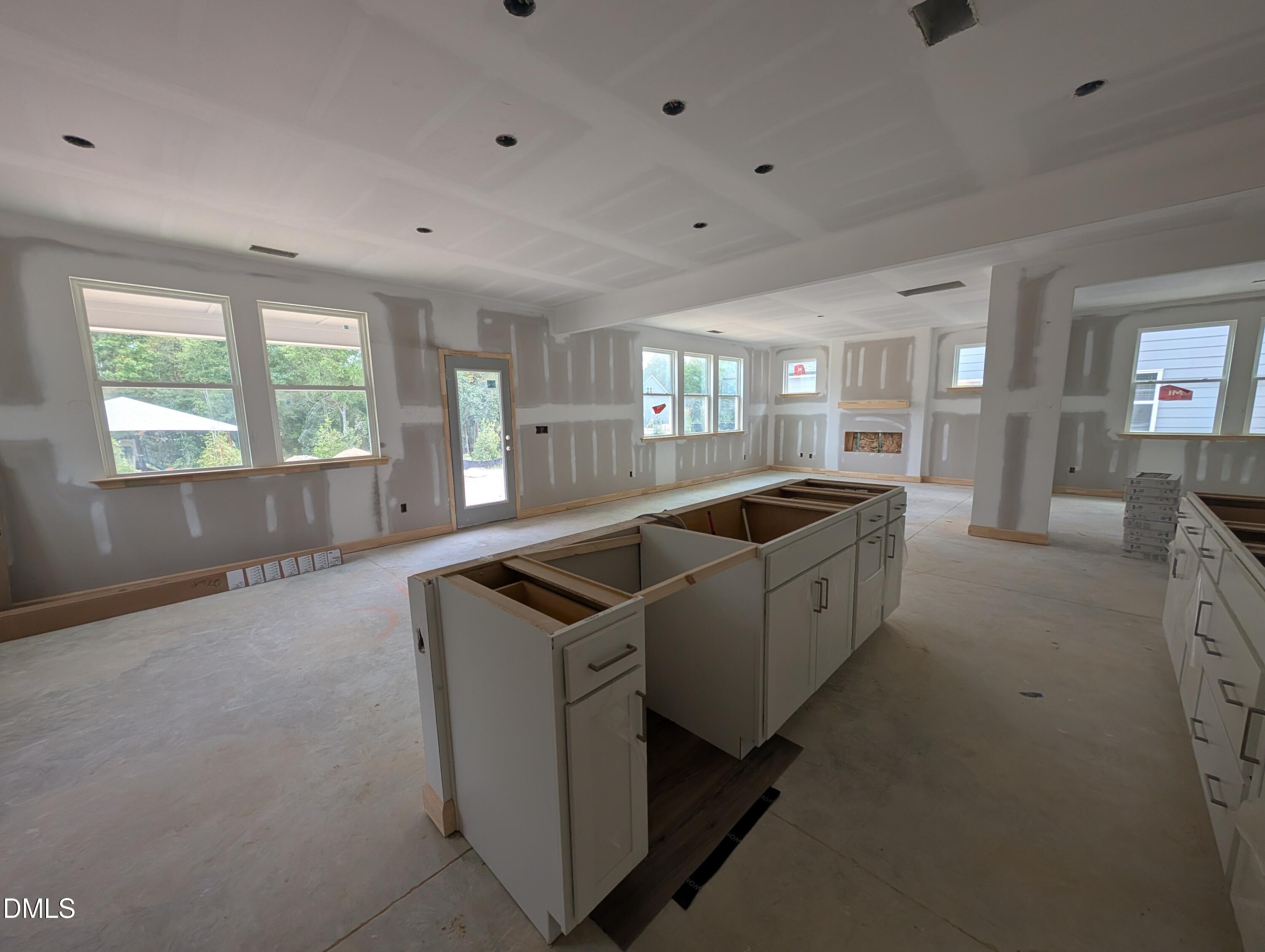 Under-construction open-concept kitchen with large island in Davidson Homes The Beech plan at Wendell Ridge, Wendell, NC