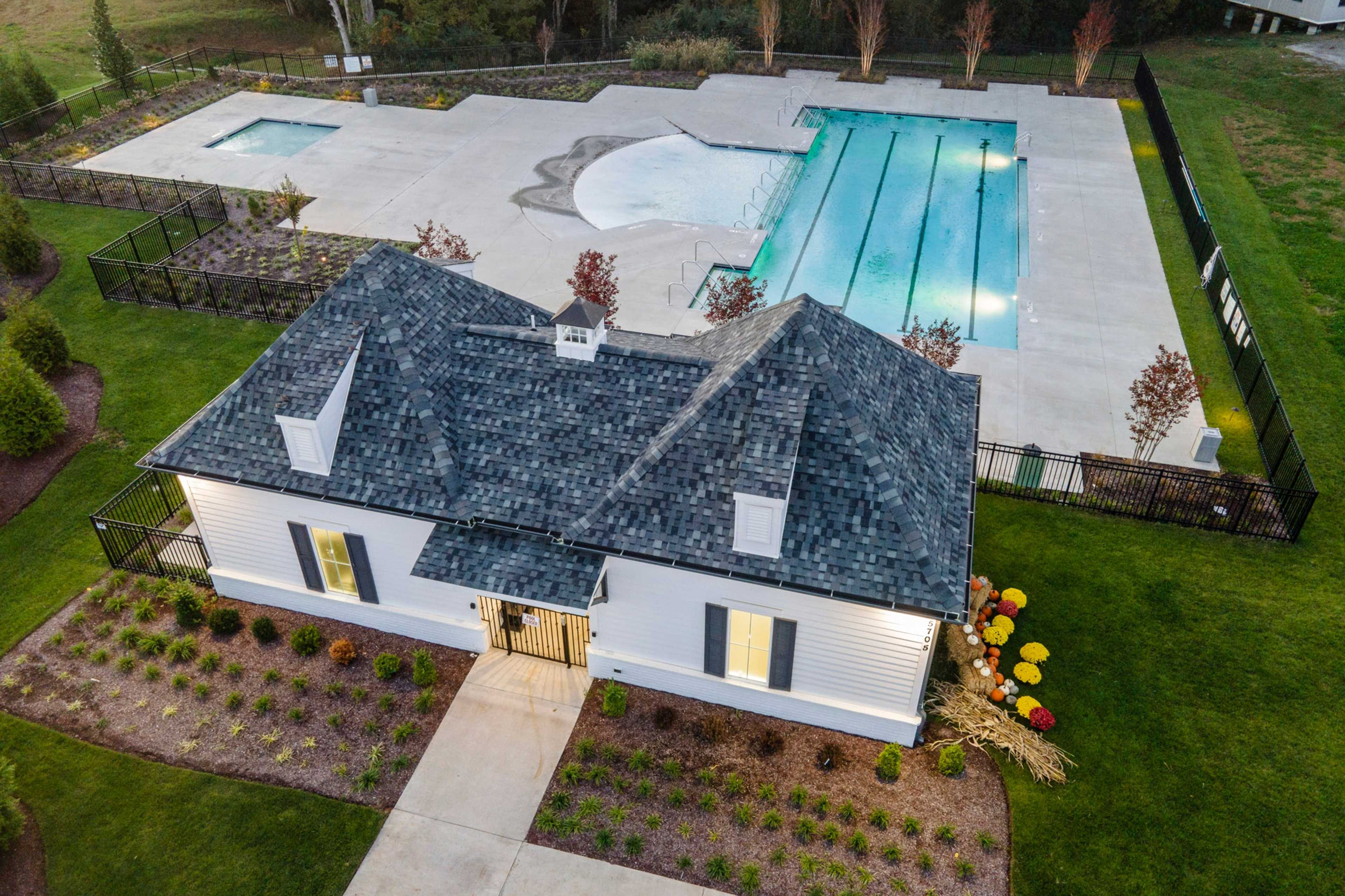 Resort-style pool and clubhouse at Shelton Square in Murfreesboro TN with sundeck, hot tub and lush landscaping