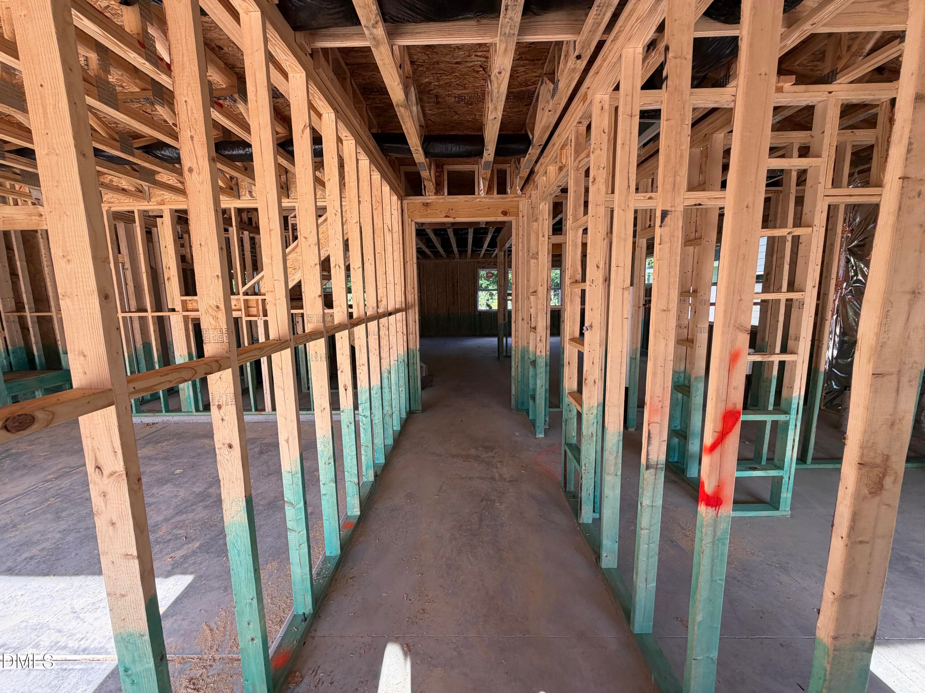 Wood-framed interior under construction on main level of Davidson Homes' The Beech 5-bedroom new build in Wendell Ridge, North Carolina