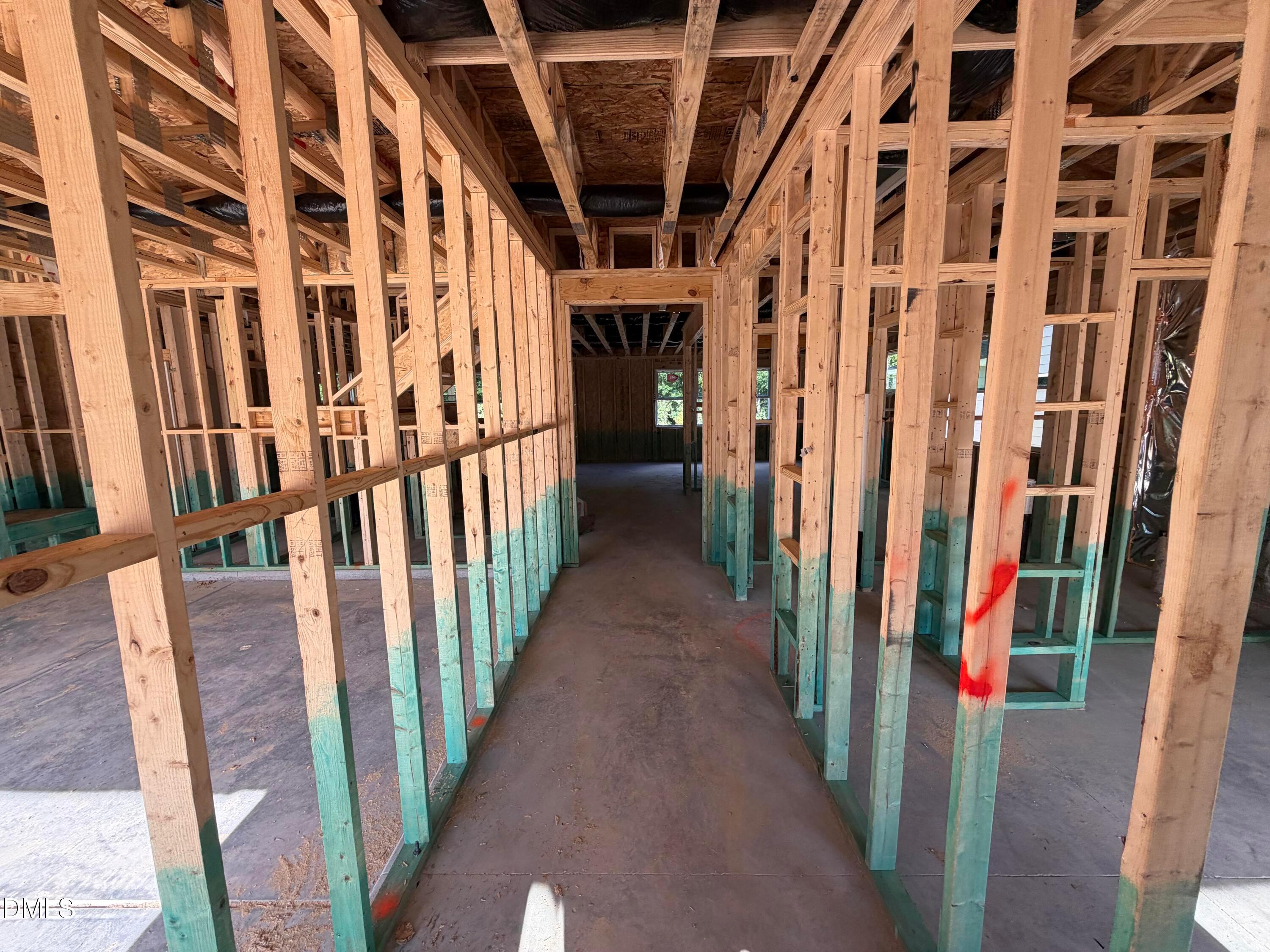 Wood-framed interior under construction on main level of Davidson Homes' The Beech 5-bedroom new build in Wendell Ridge, North Carolina