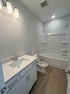 Modern bathroom with white vanity, quartz countertop, and tub-shower combo in The Daphne D home, Woodland Crossing, Zebulon.