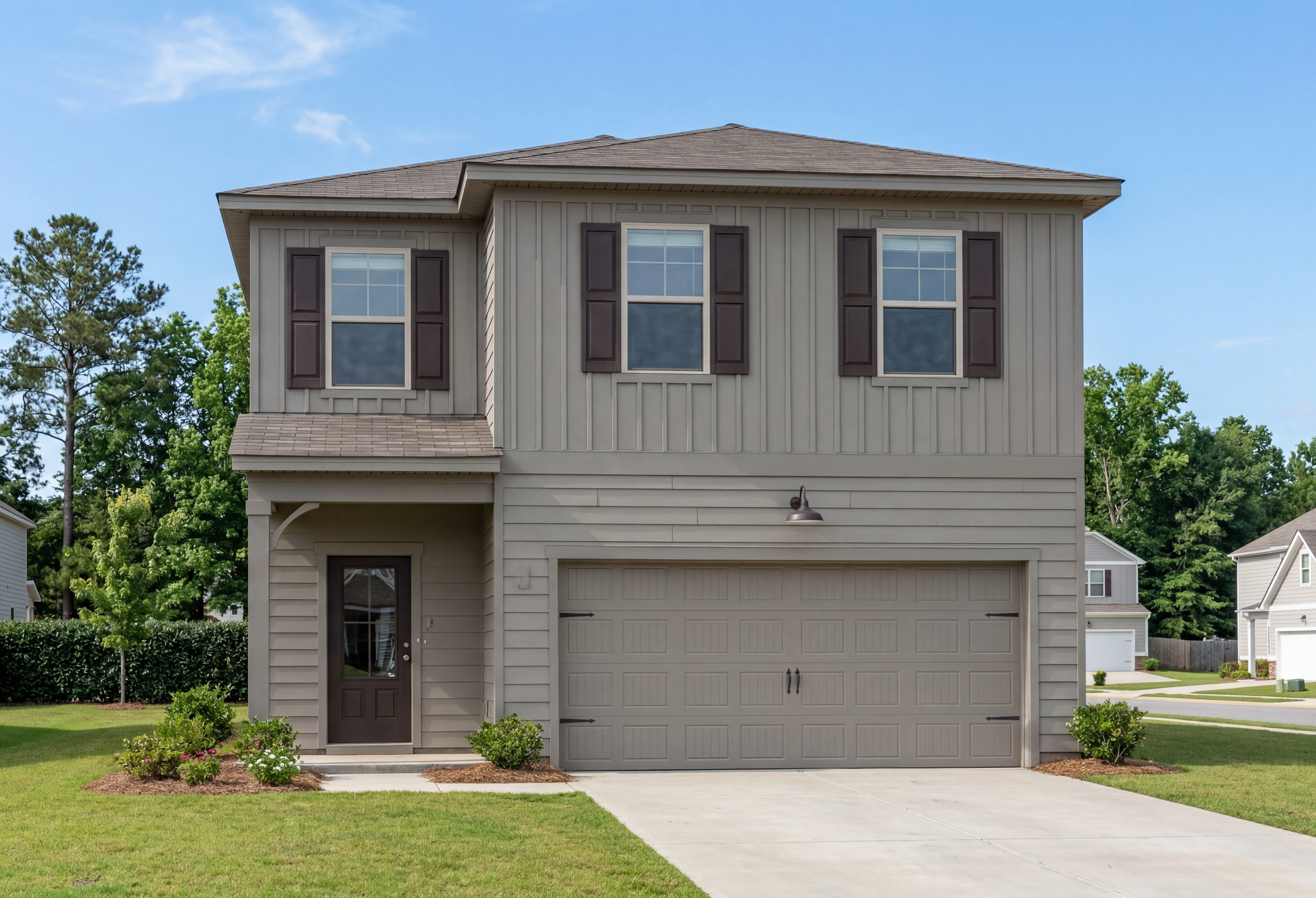 Two-story elevation of The Rabun A featuring board and batten siding, brown shutters, and a two-car garage.