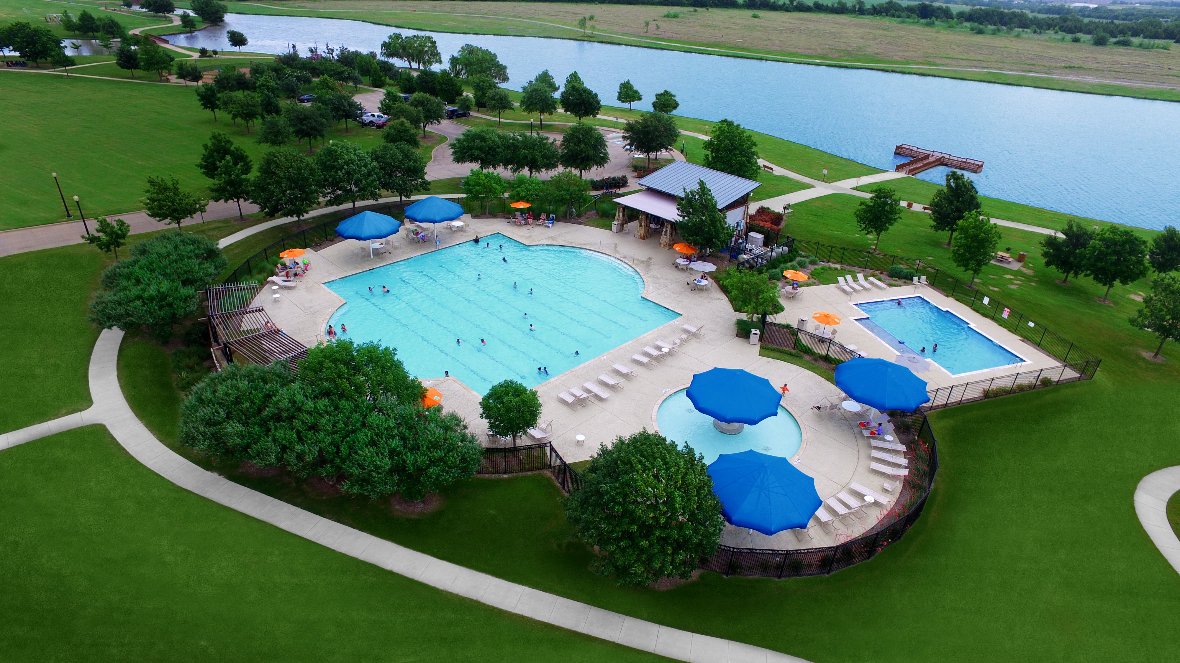Multiple pools including a lap pool with cabanas plus a lake with fishing pier