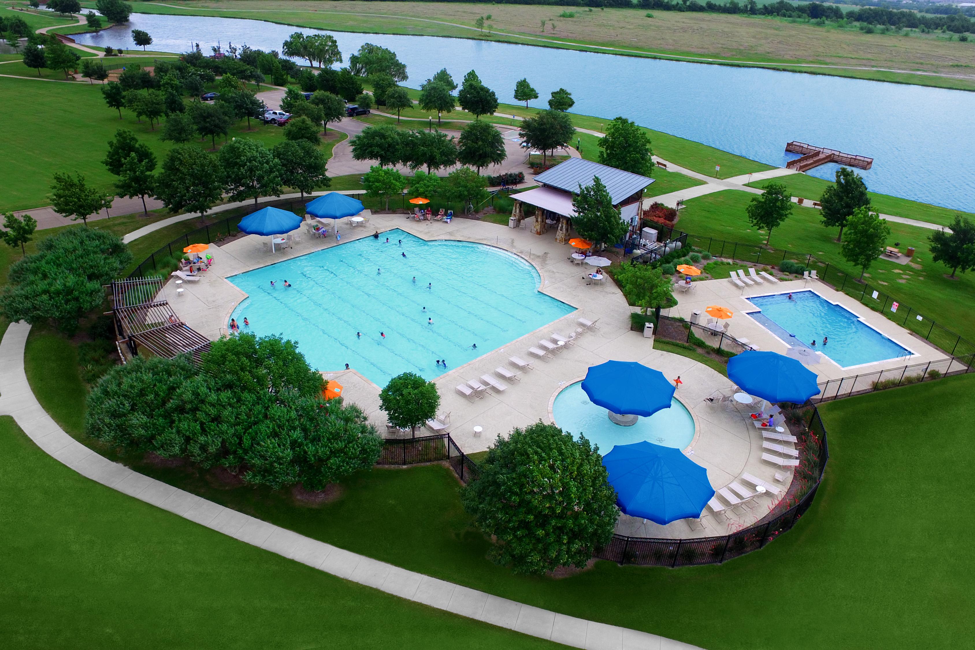Multiple pools including a lap pool with cabanas plus a lake with fishing pier