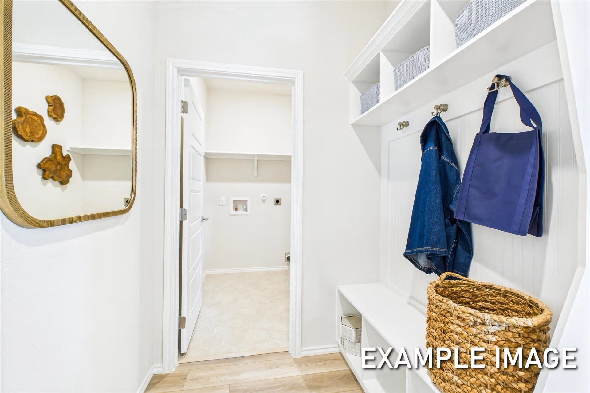 Mudroom drop zone with built-in bench and storage in a Heartland, Texas home by Davidson Homes, The Brazos E floor plan.