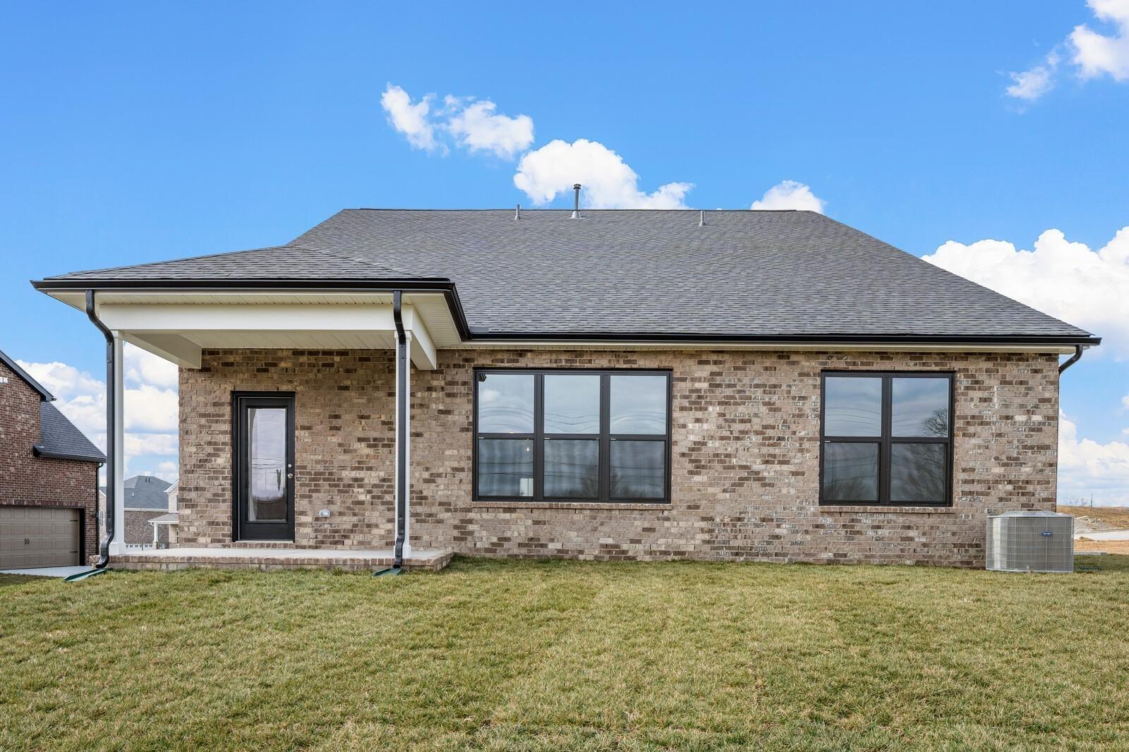 Brick exterior of The Ridgeport D floor plan by Davidson Homes with covered back patio in Benders Cove, Mt. Juliet, TN.
