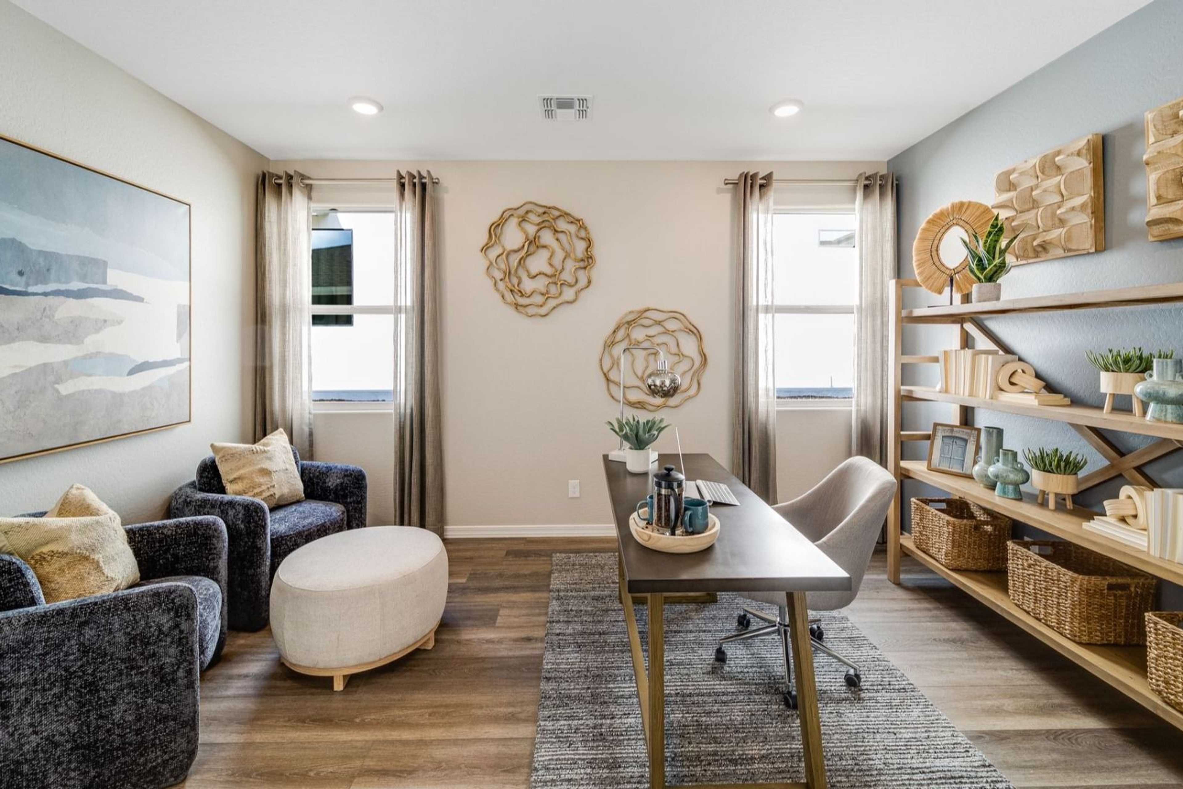 Modern home office at South Ranch Destination Collection in Prescott AZ with built-in bookshelves, desk, and abstract wall art