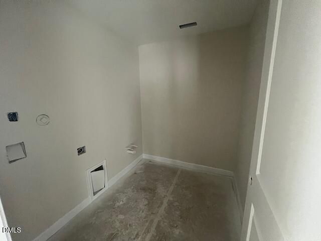 Unfinished laundry room with plumbing rough-ins, electrical outlets, and beige walls in Davidson Homes The Preston A, Lillington, NC