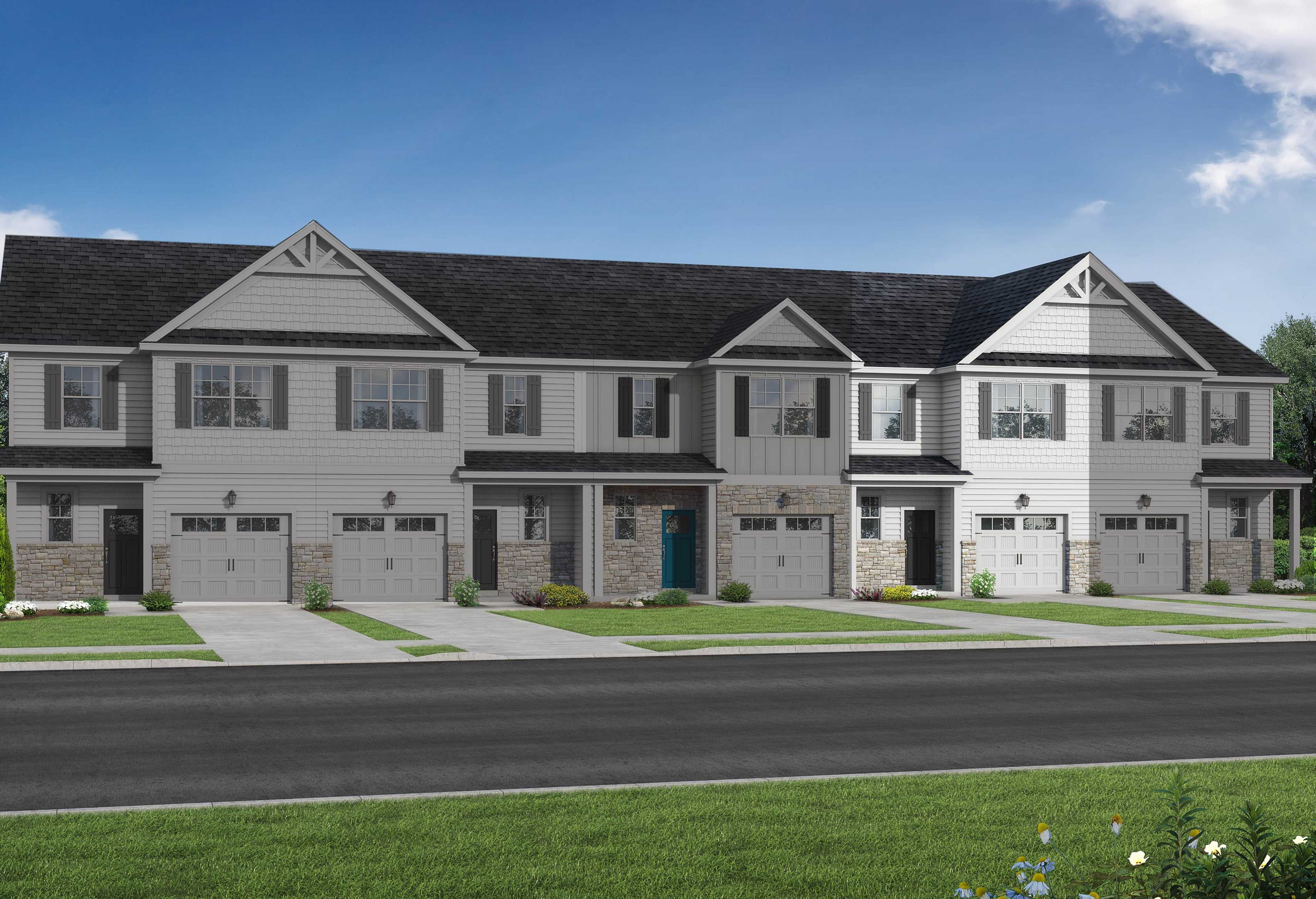 Row of modern 2-story The Graham multi-family townhomes in Fuquay-Varina, NC, featuring white siding, dark gabled roofs, 1-car garages, and landscaped yards