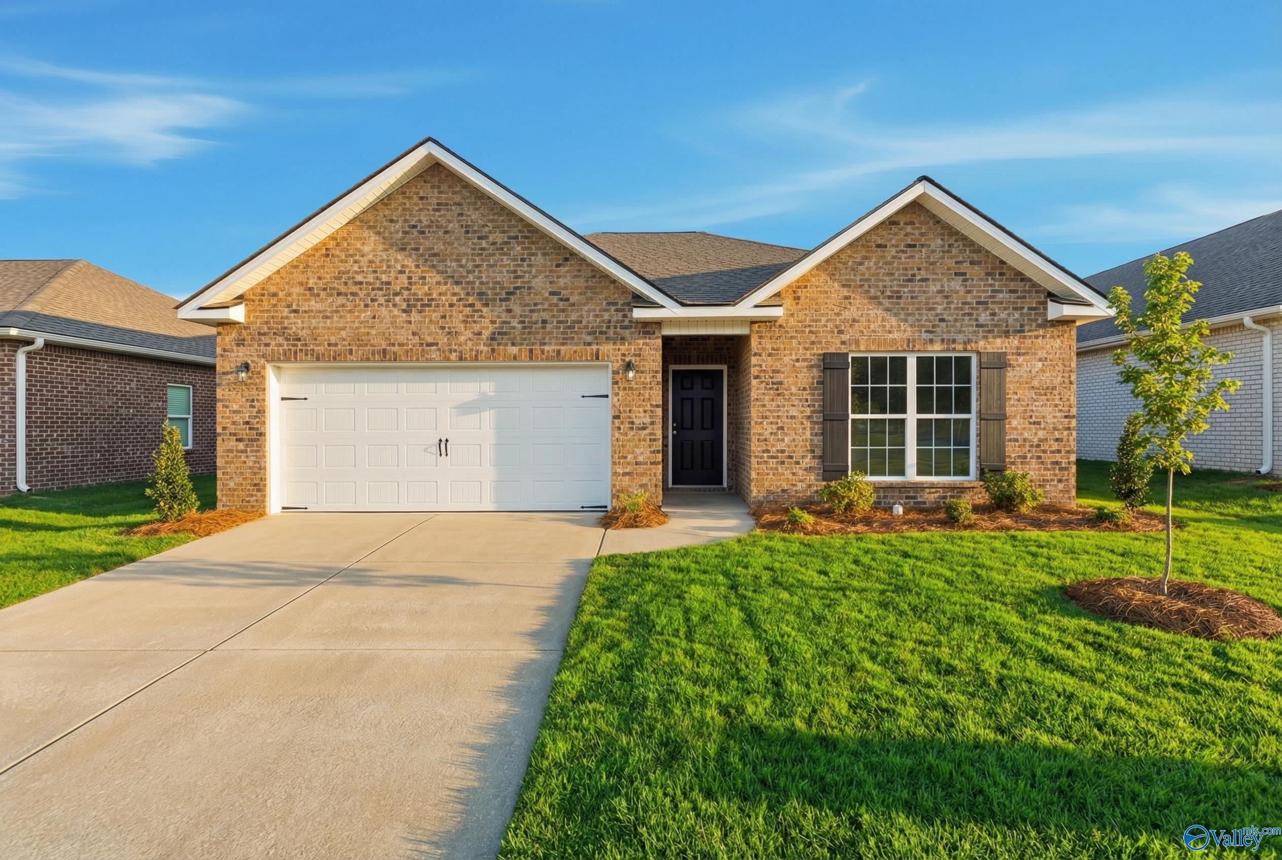Brick 1-story home with gabled roof, 2-car garage, front door, and landscaped yard in Jaguar Hills, Huntsville, Alabama - The Asheville C by Davidson Homes