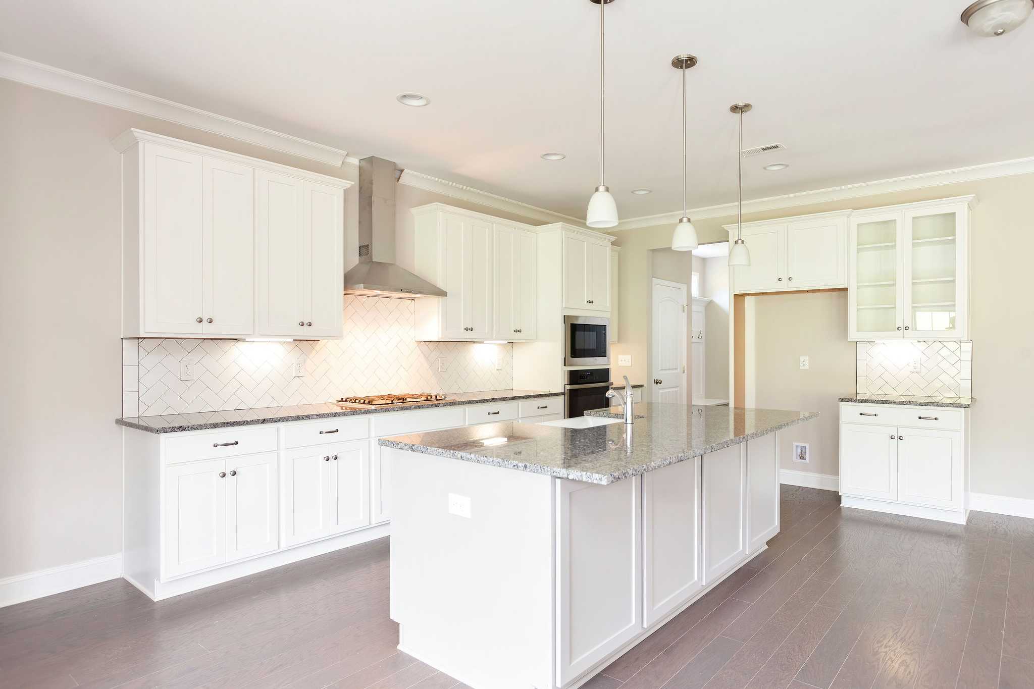 Davidson Homes The Emory Floor Plan Kitchen with Island, cabinets, and appliances