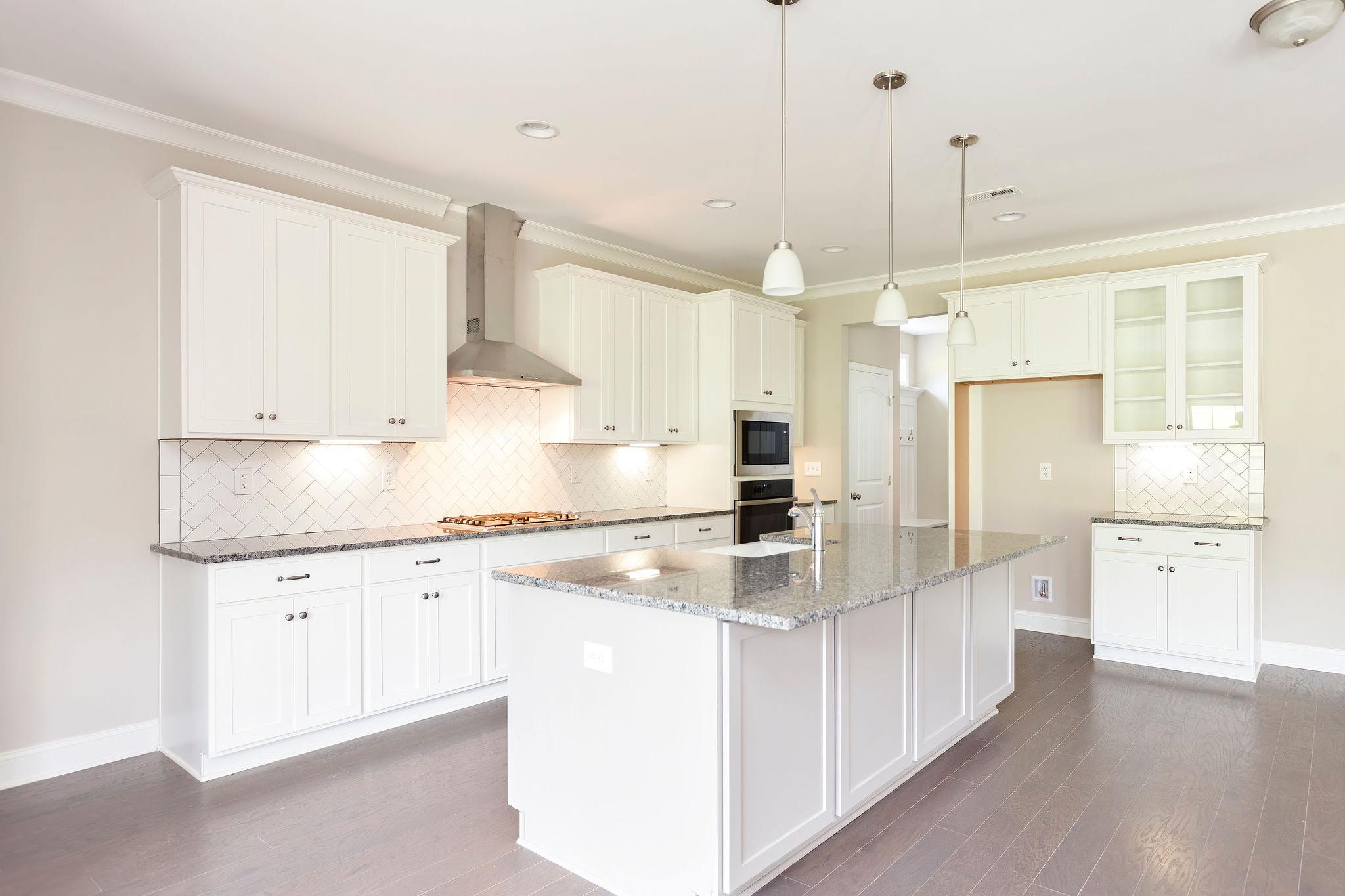 Davidson Homes The Emory Floor Plan Kitchen with Island, cabinets, and appliances