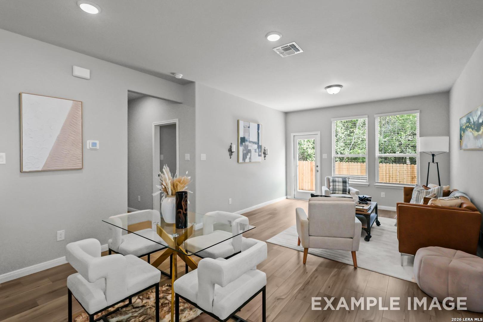 Bright open-concept dining and living area in The Gillian D floor plan by Davidson Homes in Cedar Heights, San Antonio.