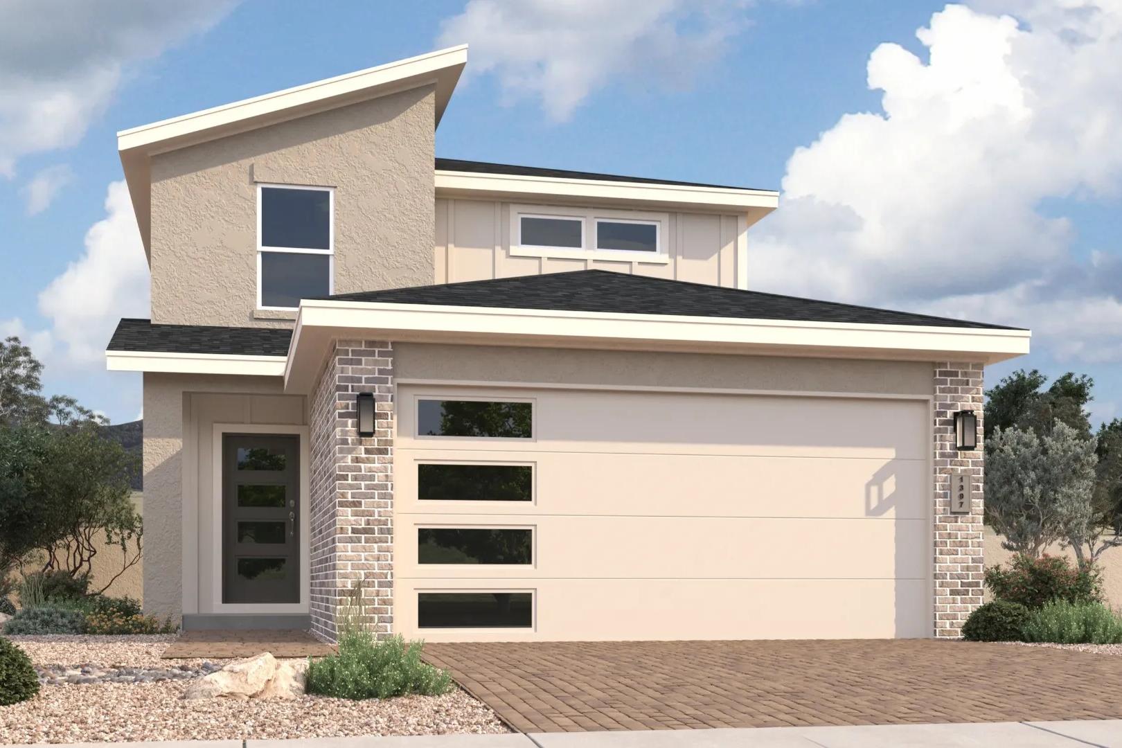 Modern stucco home exterior at South Ranch in Prescott AZ with sloped roof, glass garage doors, and desert landscaping