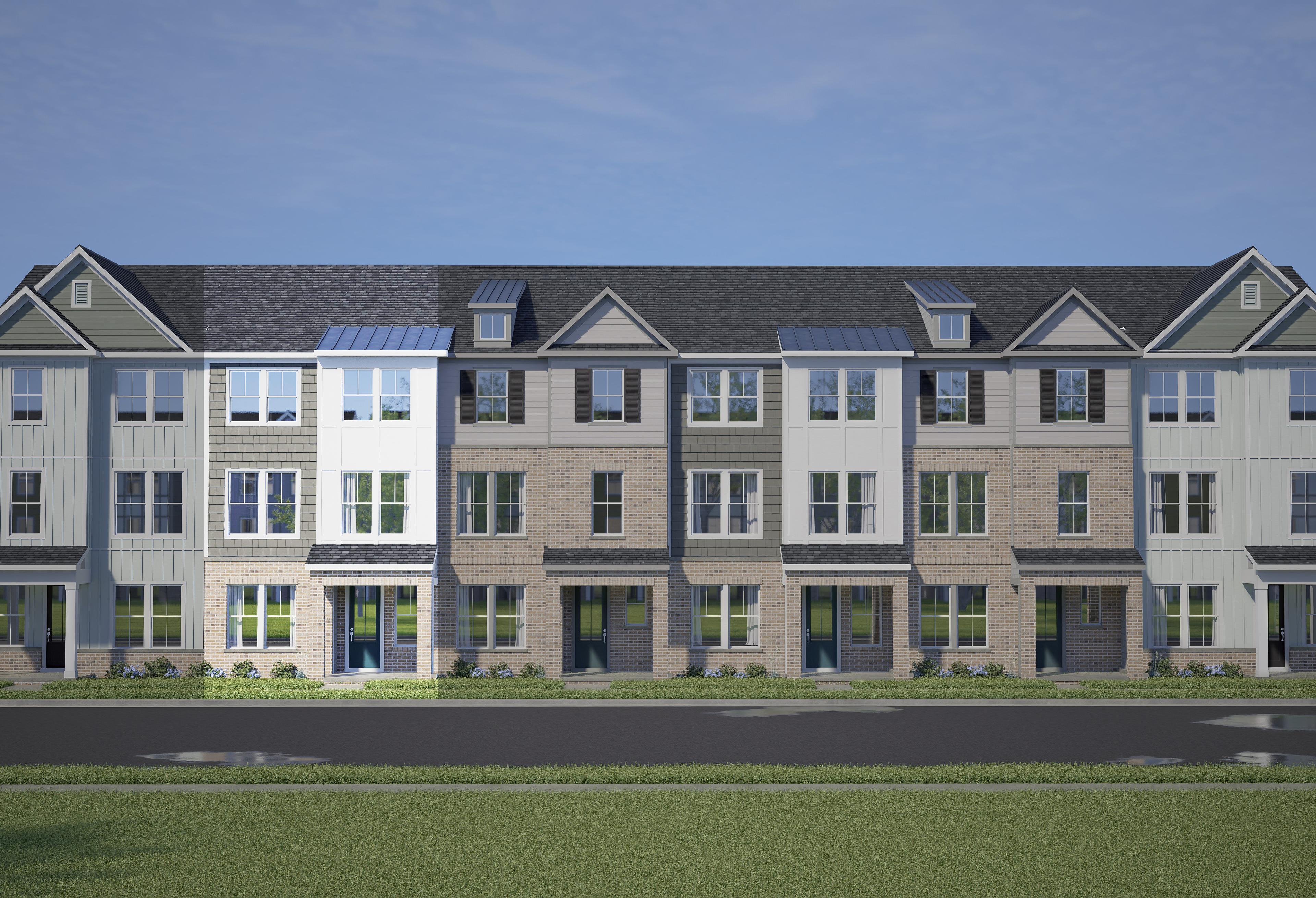 Modern row of 3-story The Avery townhomes with white, gray, and brick siding, 2-car garages, and front porches in Knightdale, NC