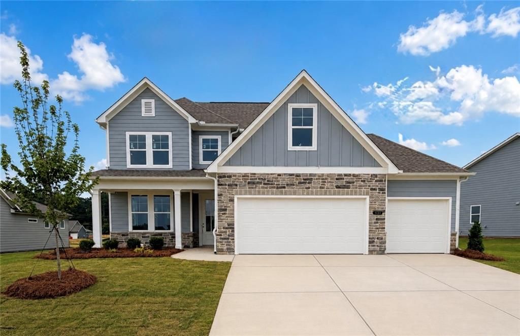 The Ash C floor plan by Davidson Homes: 3-story, 4-bedroom house with a 3-car garage in Wehunt Meadows, Hoschton, Georgia.