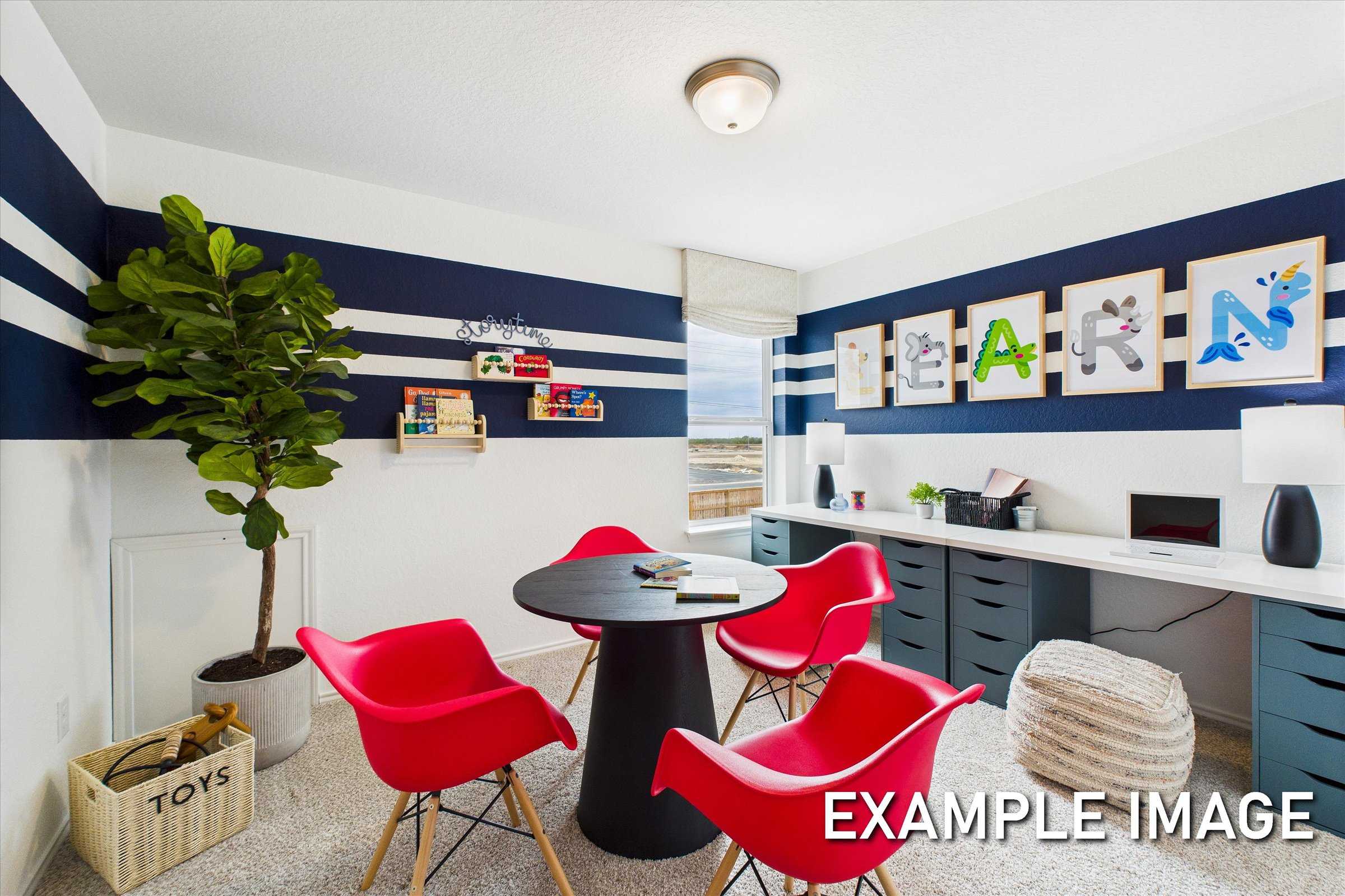 Navy striped kids' study in The Brazos A home design with red chairs, round table, dual desks, potted ficus, and toy shelves