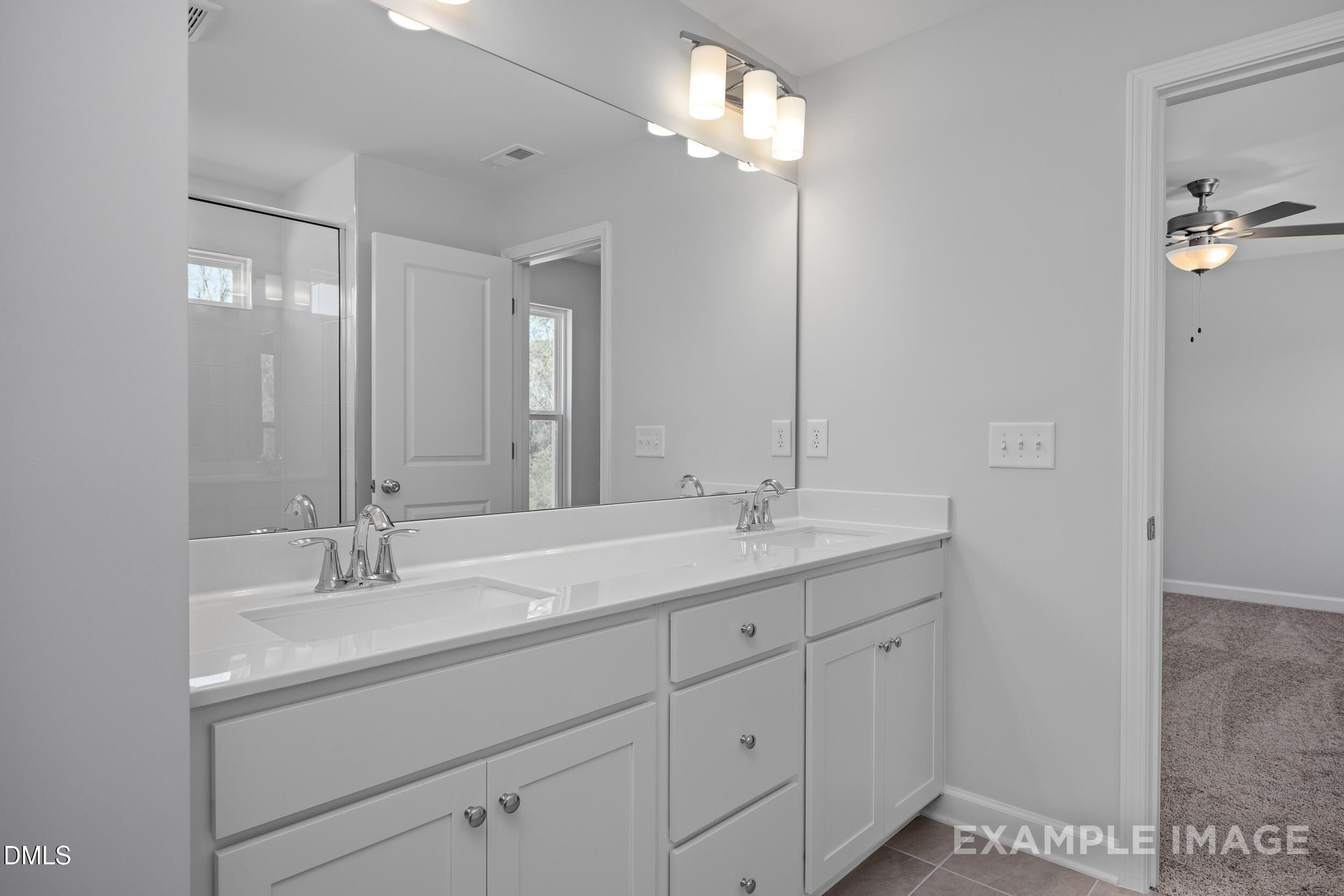 Modern dual-vanity bathroom in The Gavin A floor plan by Davidson Homes at Gregory Village in Lillington, North Carolina.