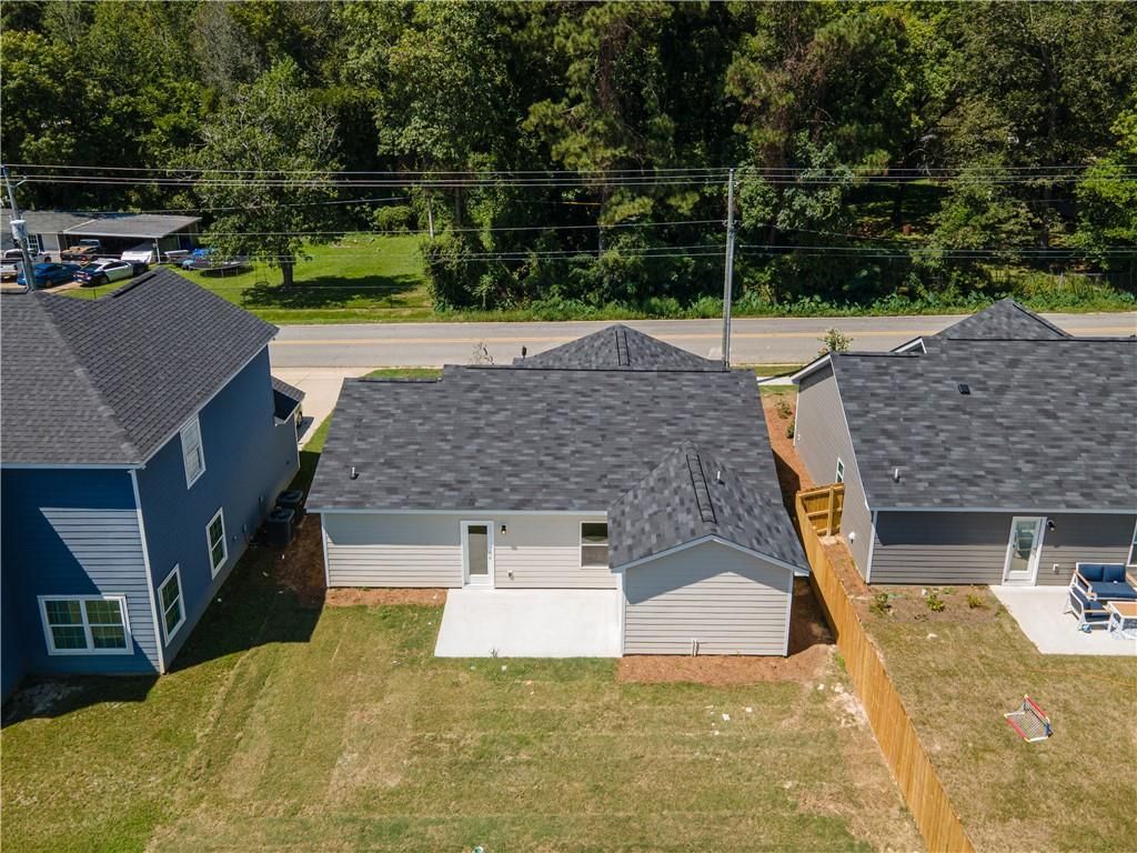 Aerial view of The Washington 3-bedroom home by Davidson Homes in Summer Vineyard, Phenix City, Alabama, with fenced backyard and concrete patio