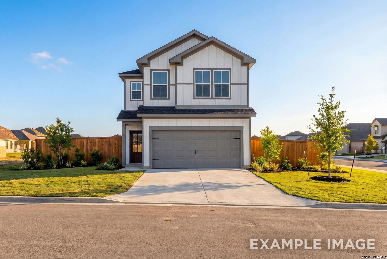 Modern two-story 4-bedroom home with shiplap siding, 2-car garage, and landscaped yard in Meadows at Oak Creek, San Antonio