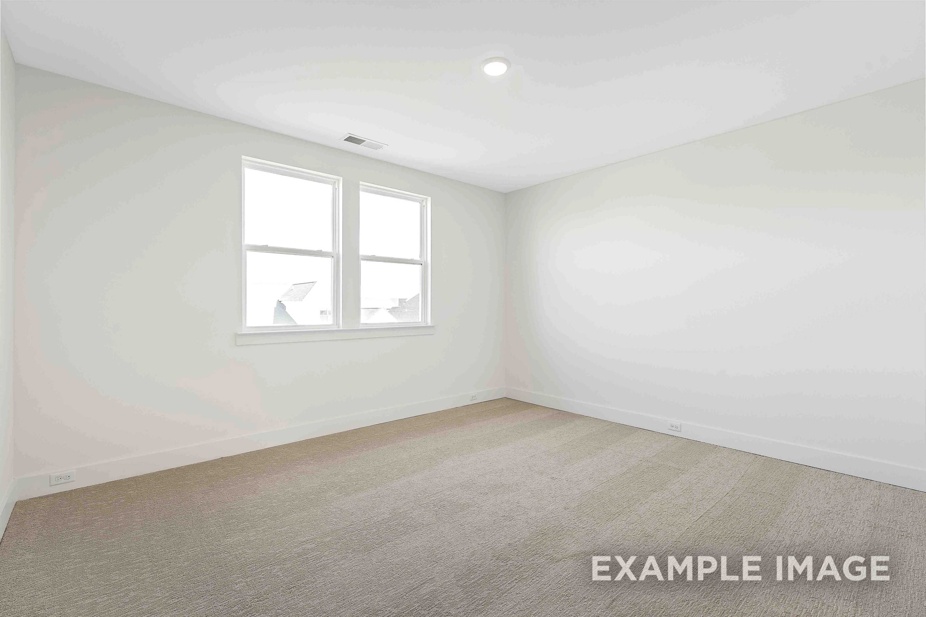 Spacious empty bedroom in The Albany A with light gray walls, double windows, recessed lighting, and beige carpet