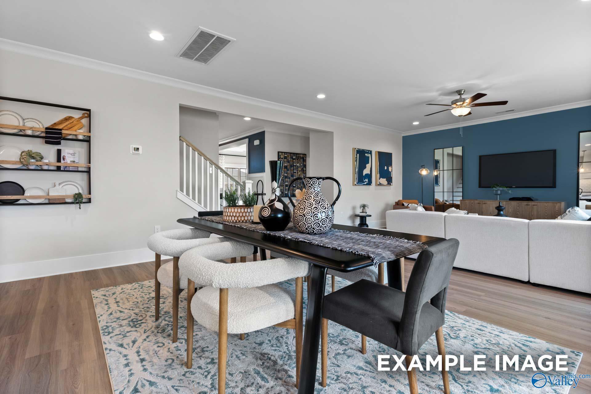 Open-concept dining area with modern decor in The Chelsea B floor plan by Davidson Homes, Ramsay Cove, Owens Cross Roads.
