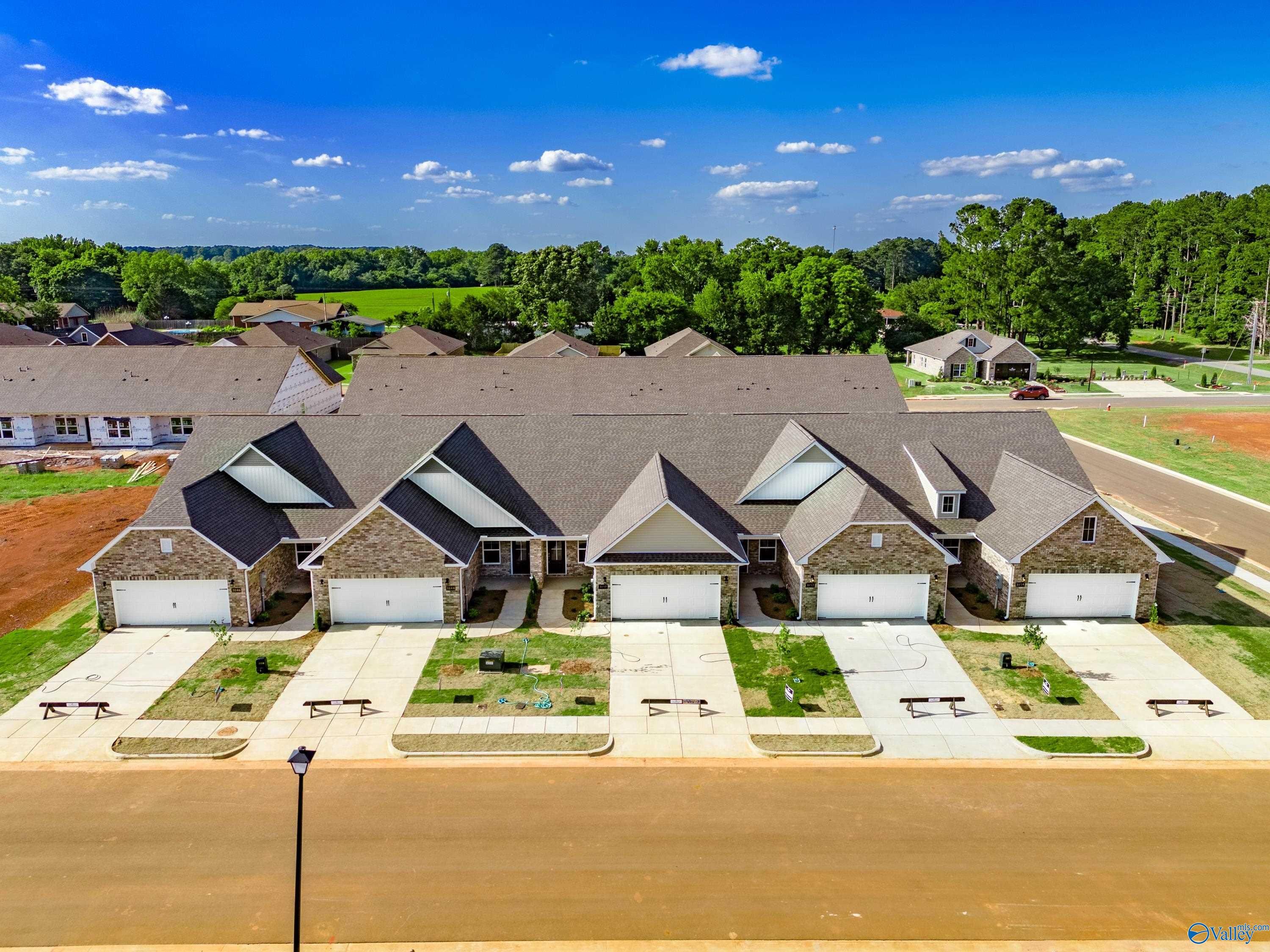 Aerial view of modern 1-story Cumberland B homes with 2-car garages in The Retreat at Hollon Meadow, Decatur, Alabama