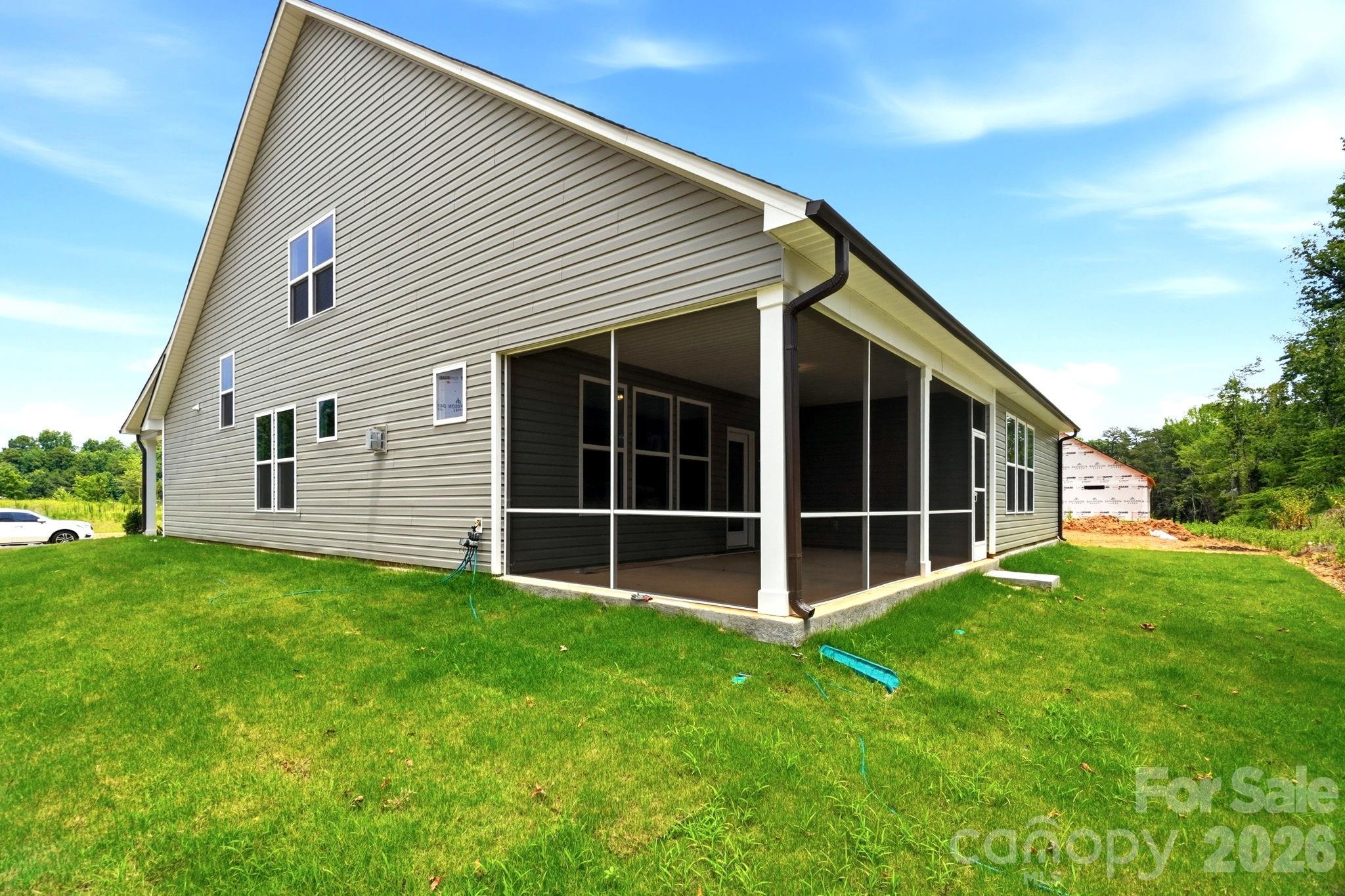Screened-in back porch on The Magnolia B floor plan by Davidson Homes in Windgate, Mooresville, North Carolina.