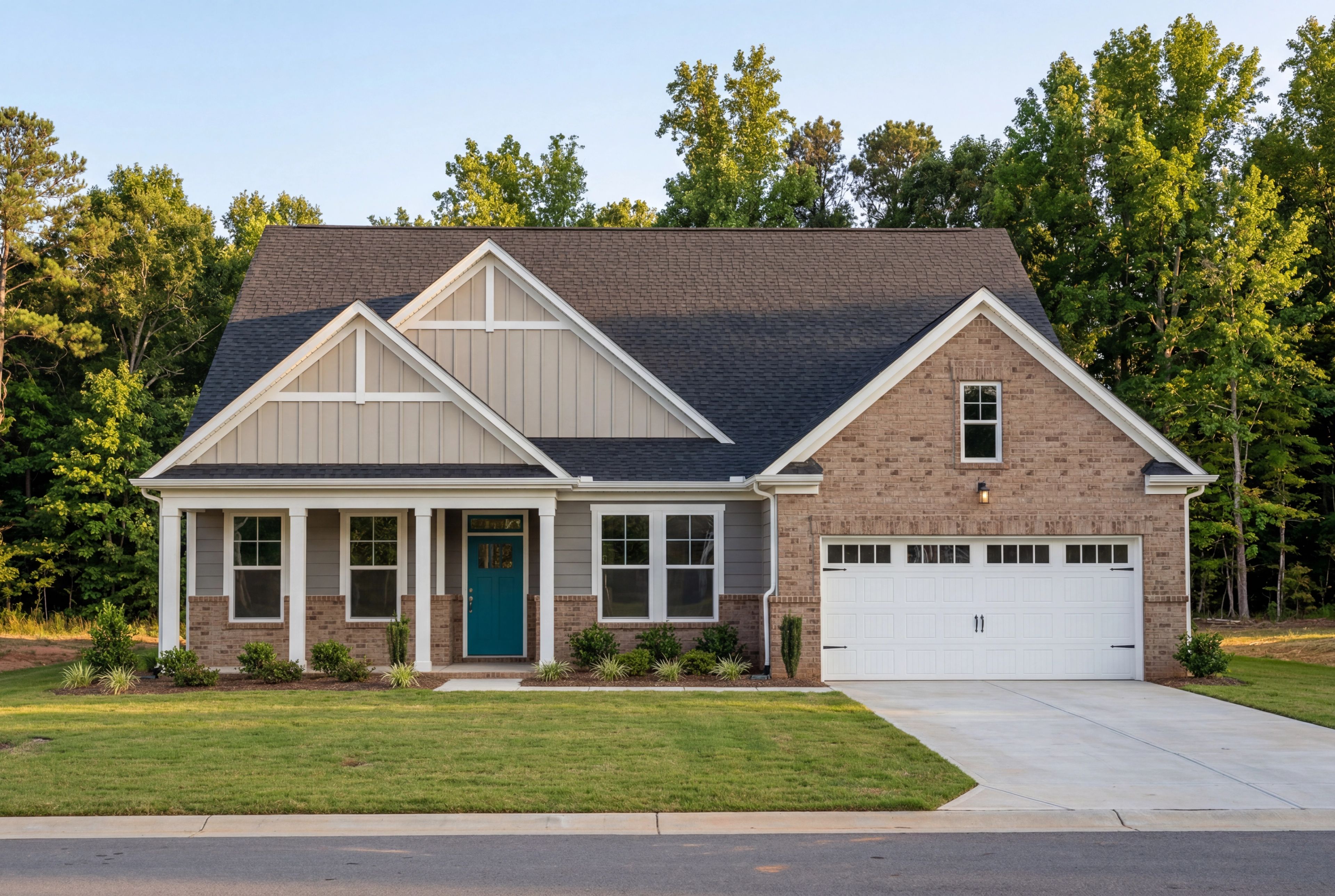 Modern The Magnolia A single-story home featuring brick and vinyl exterior, gabled roof, covered porch, and 2-car garage in Holly Springs NC