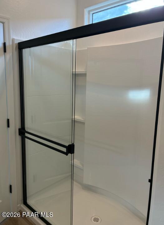 Modern glass walk-in shower with matte black frame in Davidson Homes The Newport A bathroom, Prescott, Arizona new home