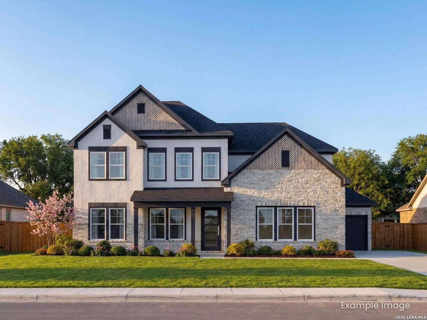 Two-story Davidson Homes Belmont H floor plan with stone and stucco exterior in Potranco Oaks, Castroville, Texas.