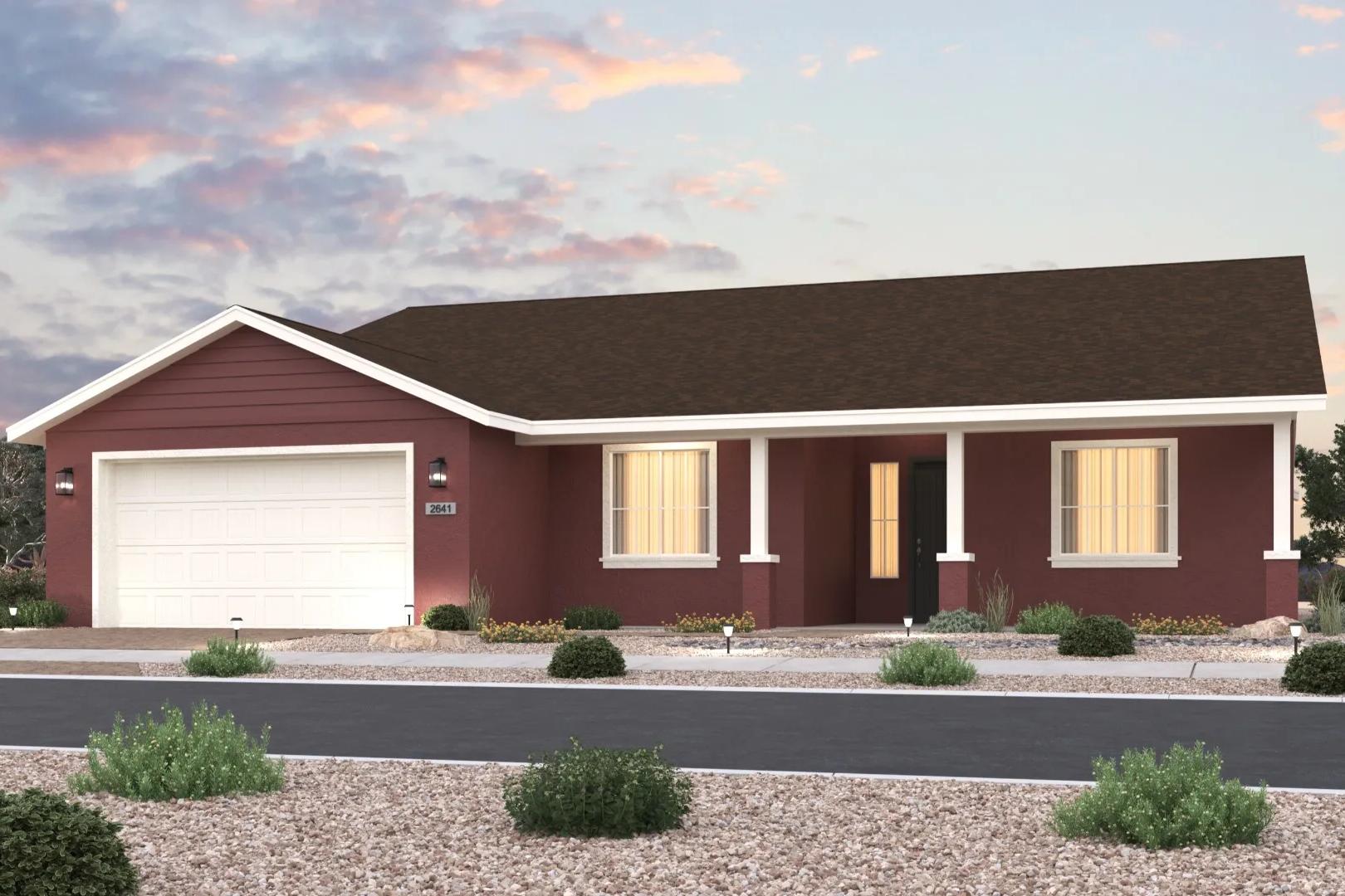 Charming single-story The Sunrise II elevation with red siding, two-car garage, covered porch, and desert landscaping in Prescott AZ