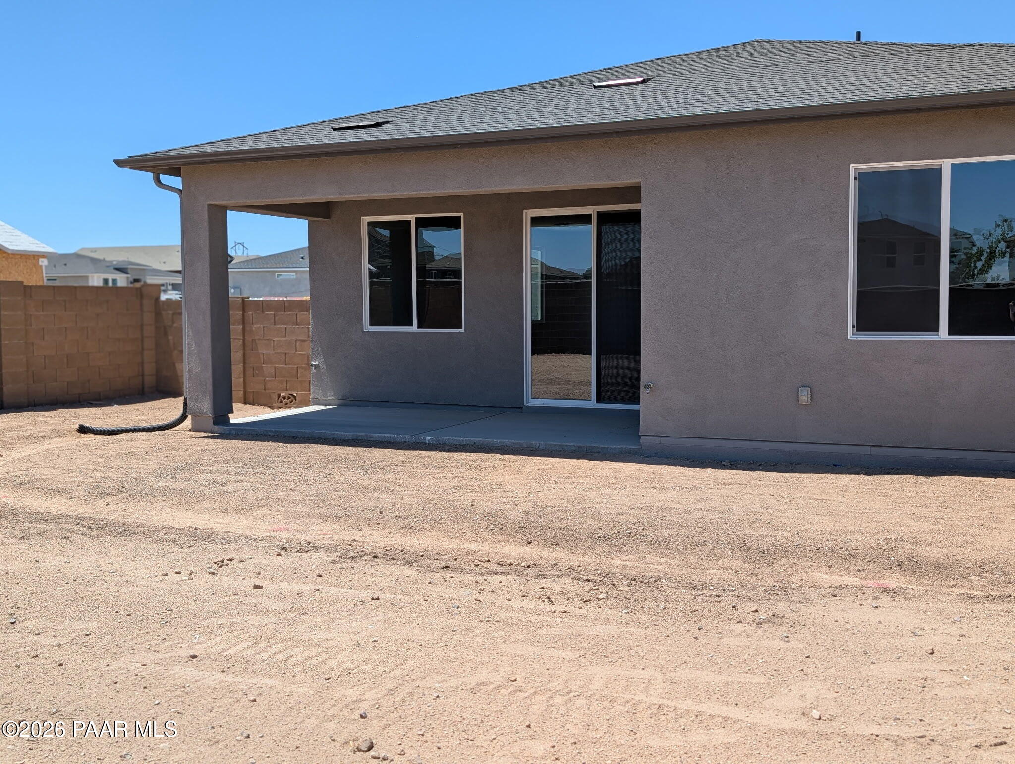Covered back patio of The Frontier II F floor plan by Davidson Homes in South Ranch, Prescott, Arizona.