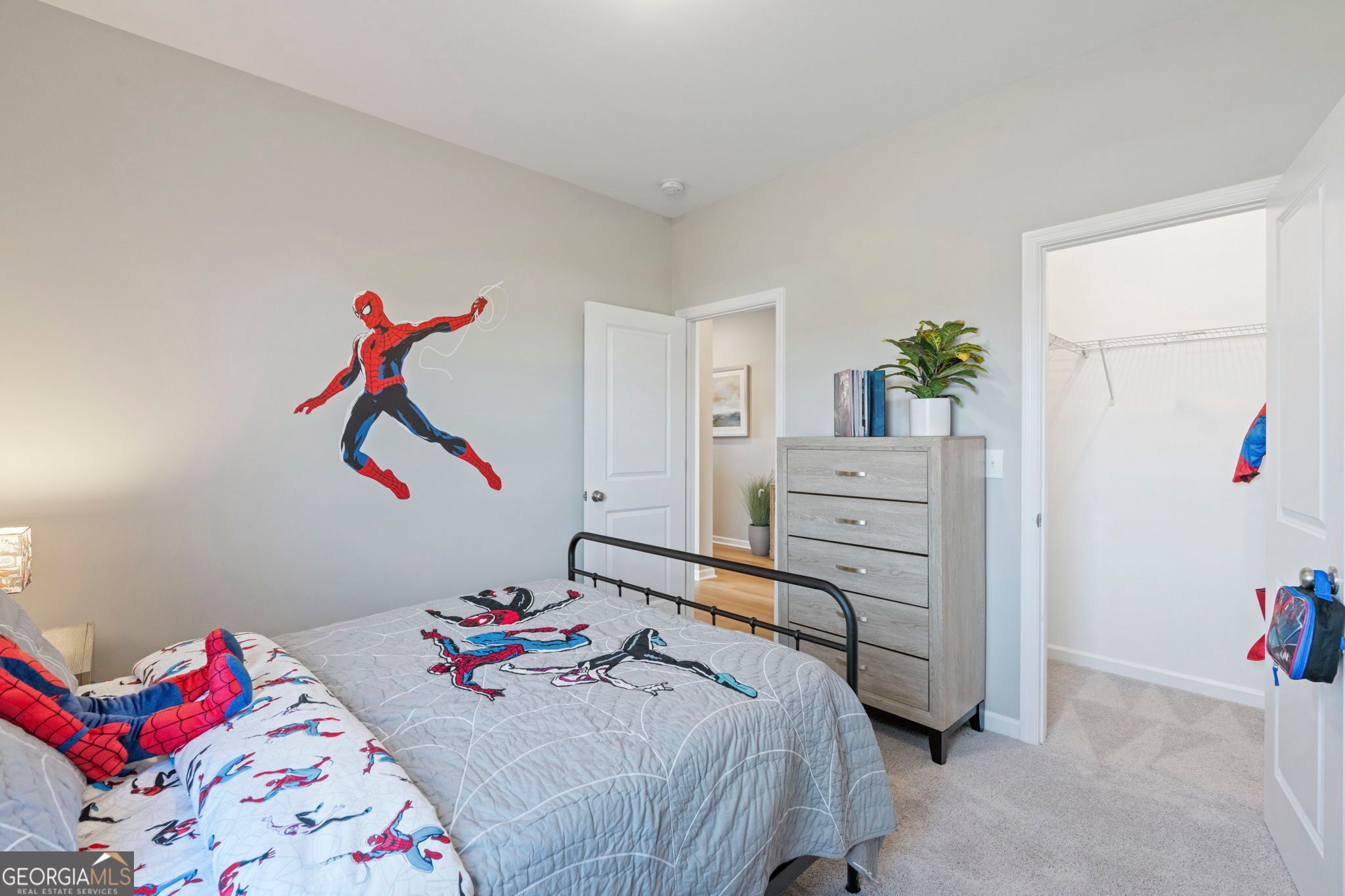 Spider-Man themed kids' bedroom with twin bed, dresser, and closet in Evermore Homes The Phoenix, Ivy Glen, Perry, GA