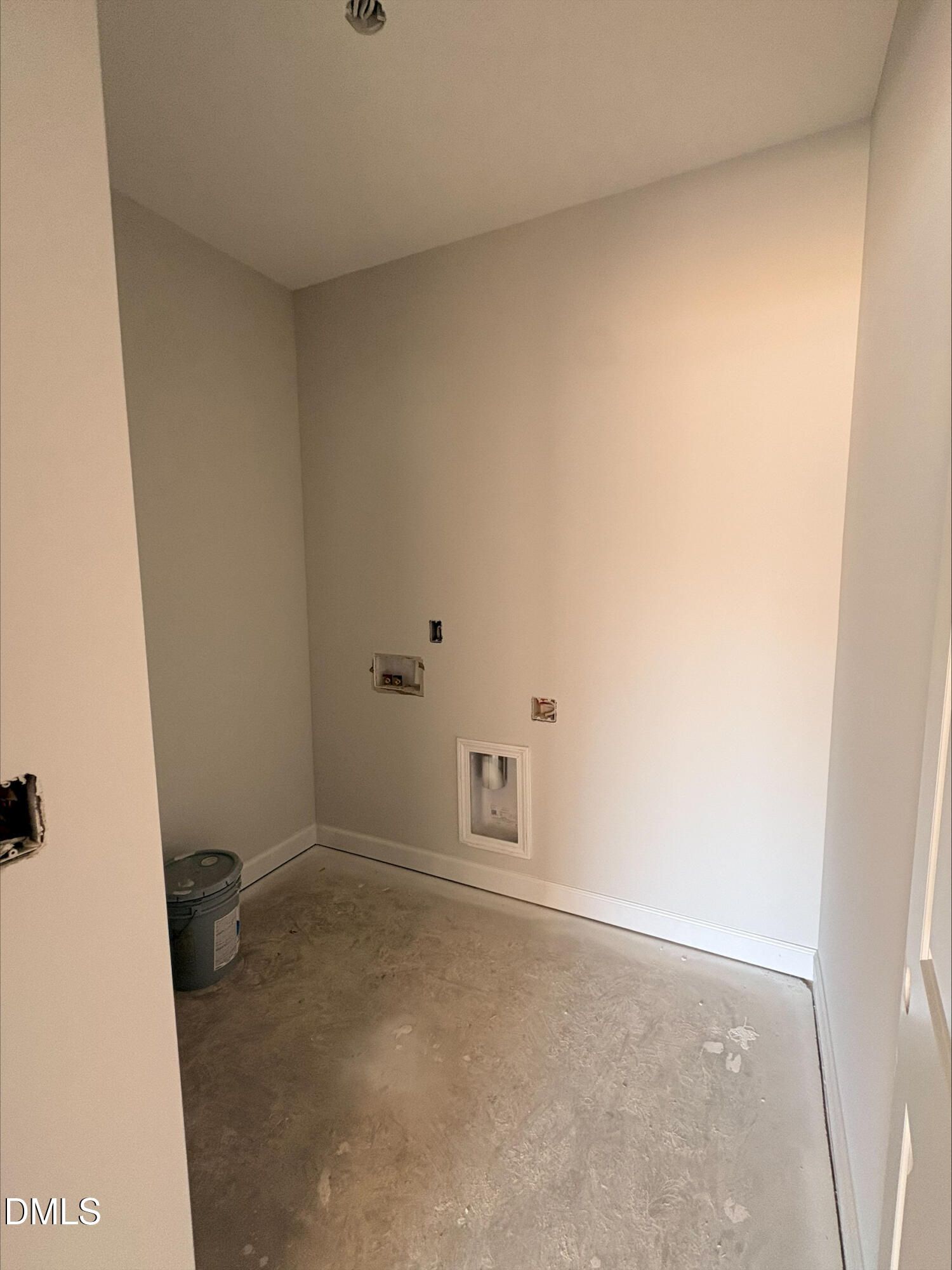 Unfinished laundry room with utility hookups in The Daphne D floor plan by Davidson Homes in Woodland Crossing, Zebulon, NC.