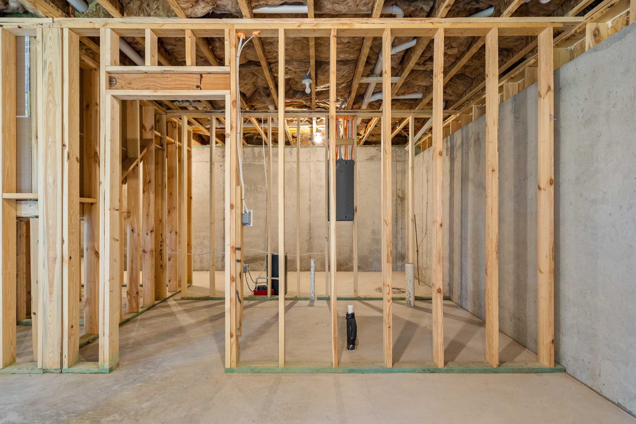 Wooden framing and electrical wiring in The Ash B basement construction, Hoschton GA single-family home
