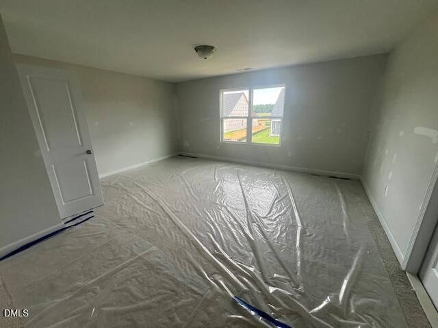 Spacious unfinished bedroom in The Ash B floor plan at Retreat at North Main in Lillington, NC by Davidson Homes.
