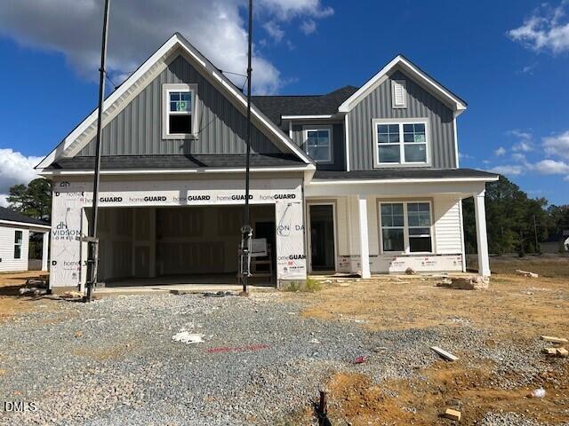 New two-story Davidson Homes The Ash C house under construction with 2-car garage in Retreat at North Main, Lillington, NC