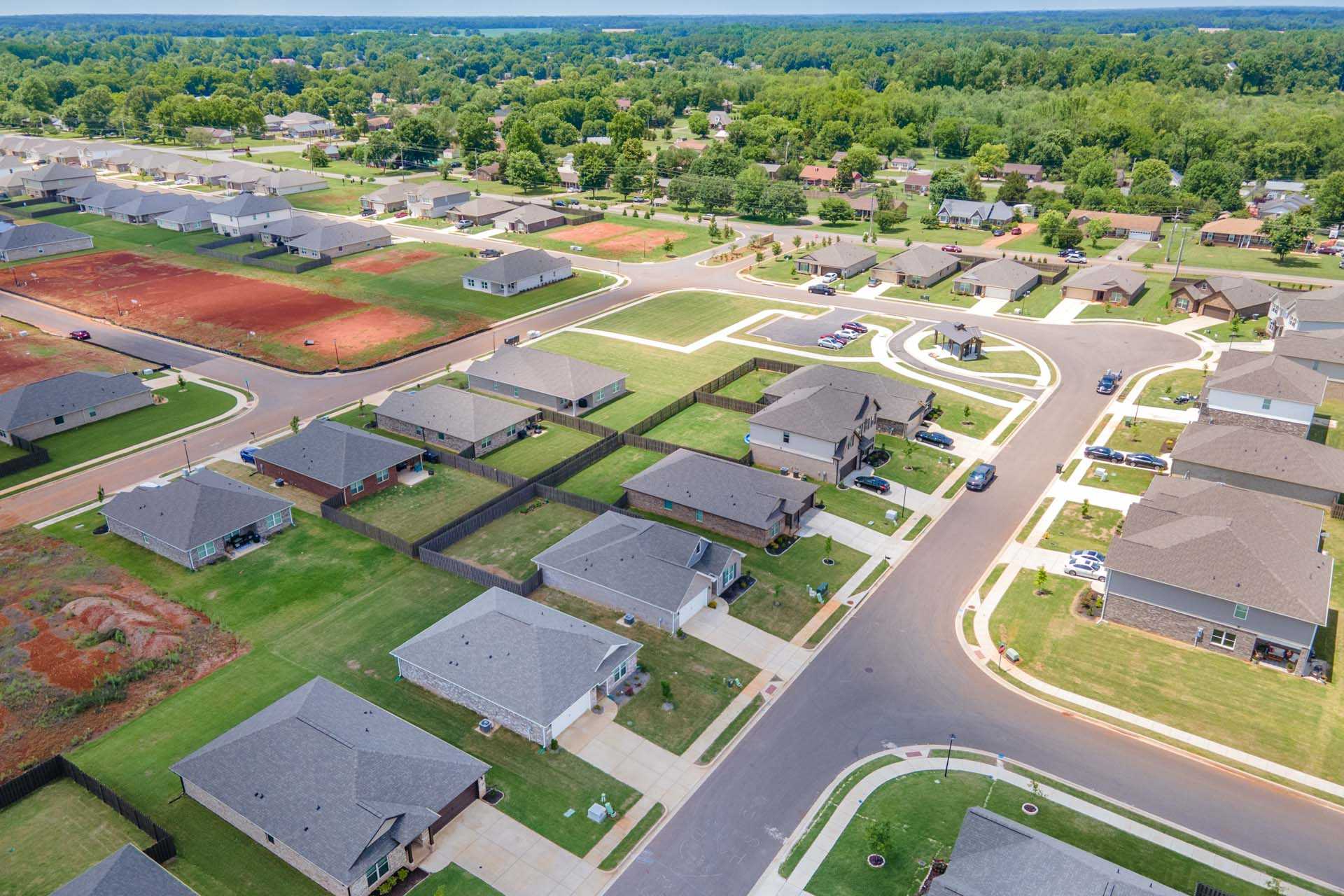 Aerial view of new Davidson Homes in Clearview neighborhood, Hazel Green Alabama with tree-lined streets and green lawns