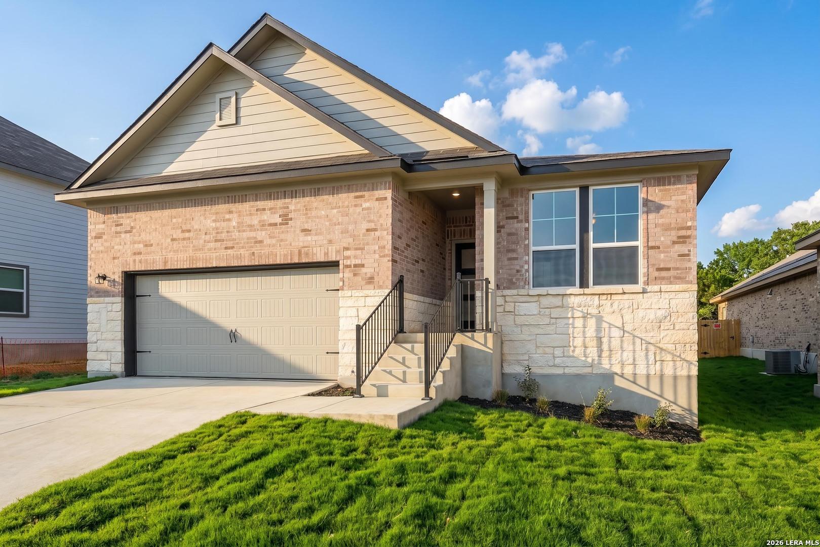 Single-story Davidson Homes Glenwood F floor plan with brick and stone exterior in Royal Crest, San Antonio, Texas.