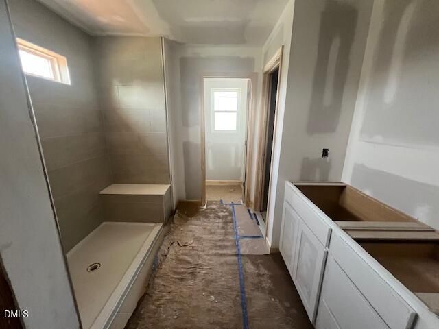 Unfinished master bathroom with tiled walk-in shower and vanity in The Gavin C floor plan at Gregory Village, Lillington.
