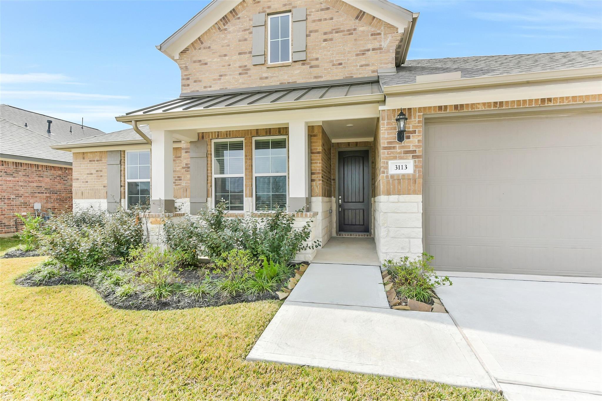 The Edward C floor plan by Davidson Homes featuring a brick exterior and two-car garage in Lago Mar, Texas City, Texas.