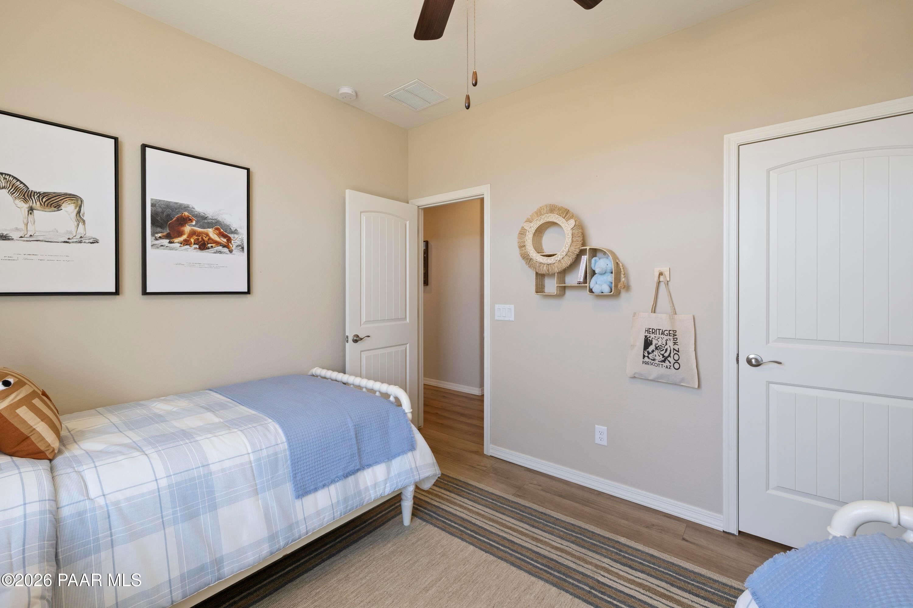 Cozy bedroom with animal-themed decor in The Harmony A floor plan at North Ridge, Pronghorn Ranch, Prescott Valley, AZ.